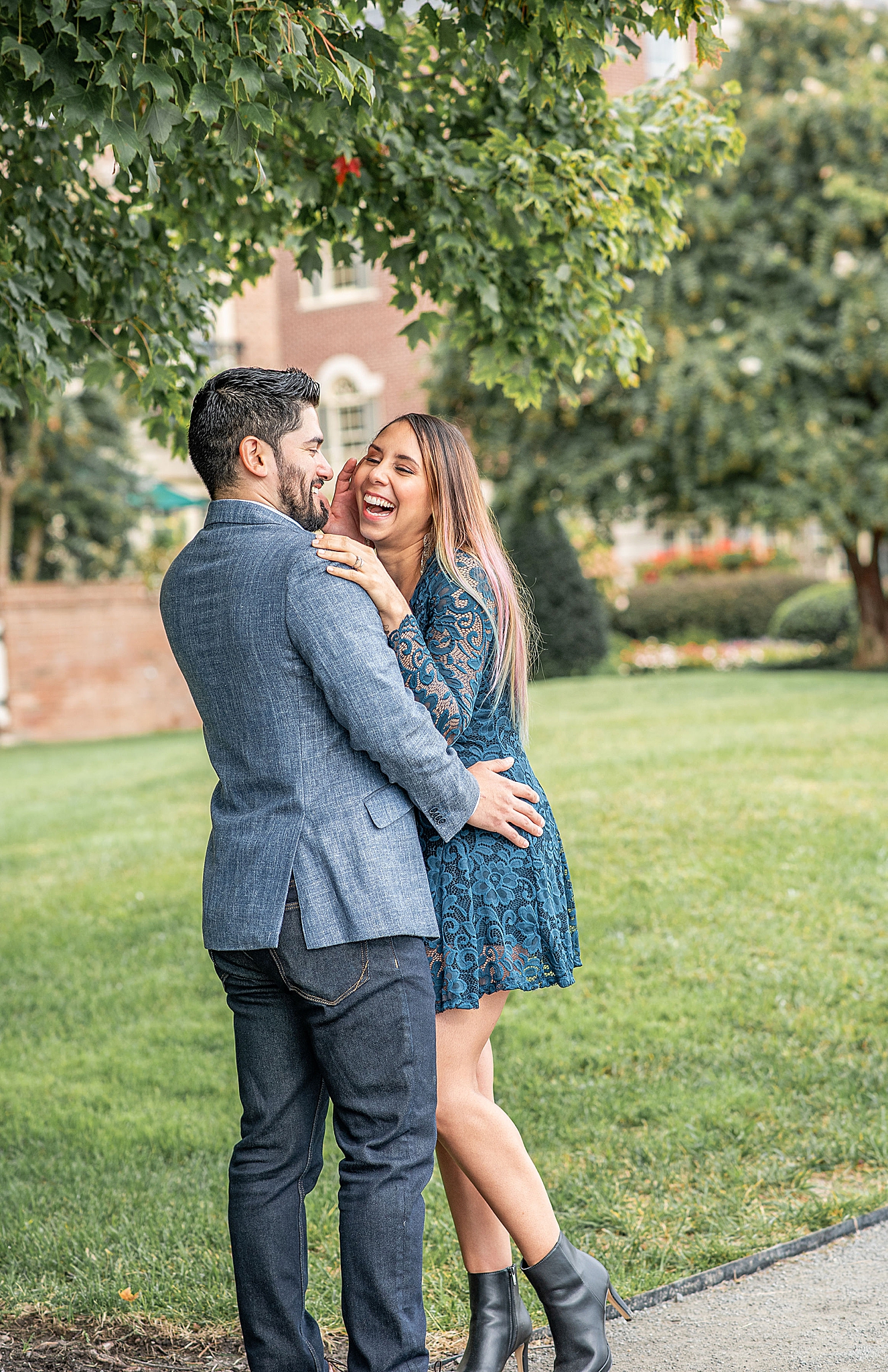 groom makes fiancee laugh during VA engagement photos