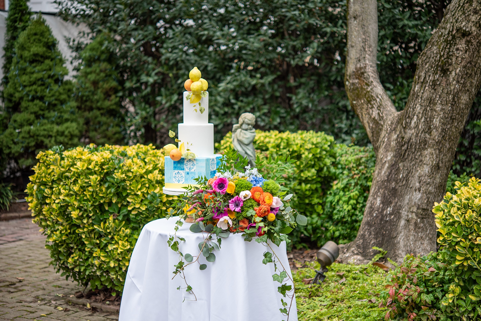 cake table with blue details and lemons