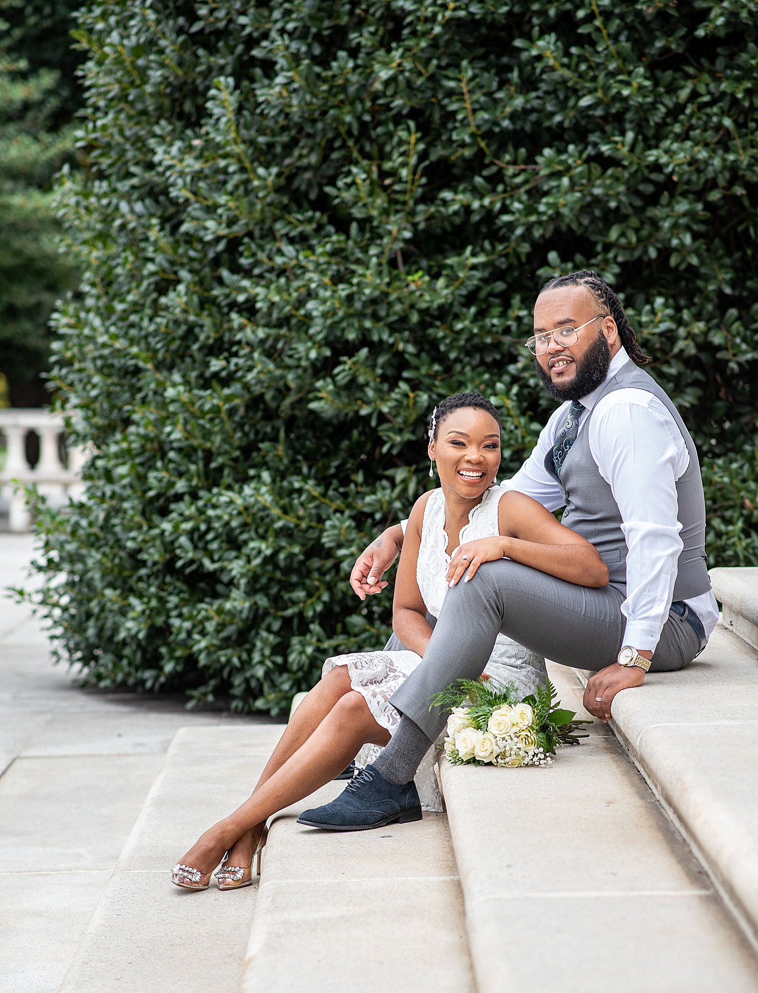 married couple poses on steps in DC