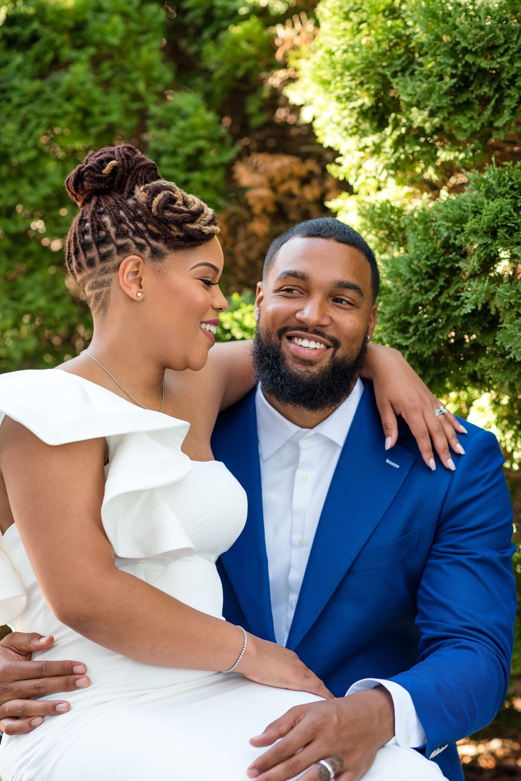 bride and groom laugh during Capitol Hill anniversary portraits
