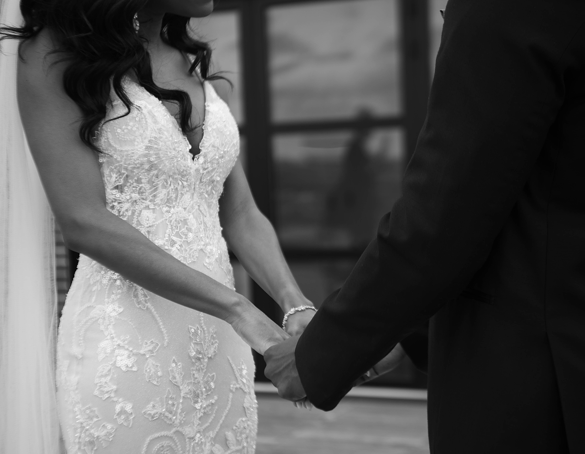 bride and groom hold hands during first look on Washington DC roof