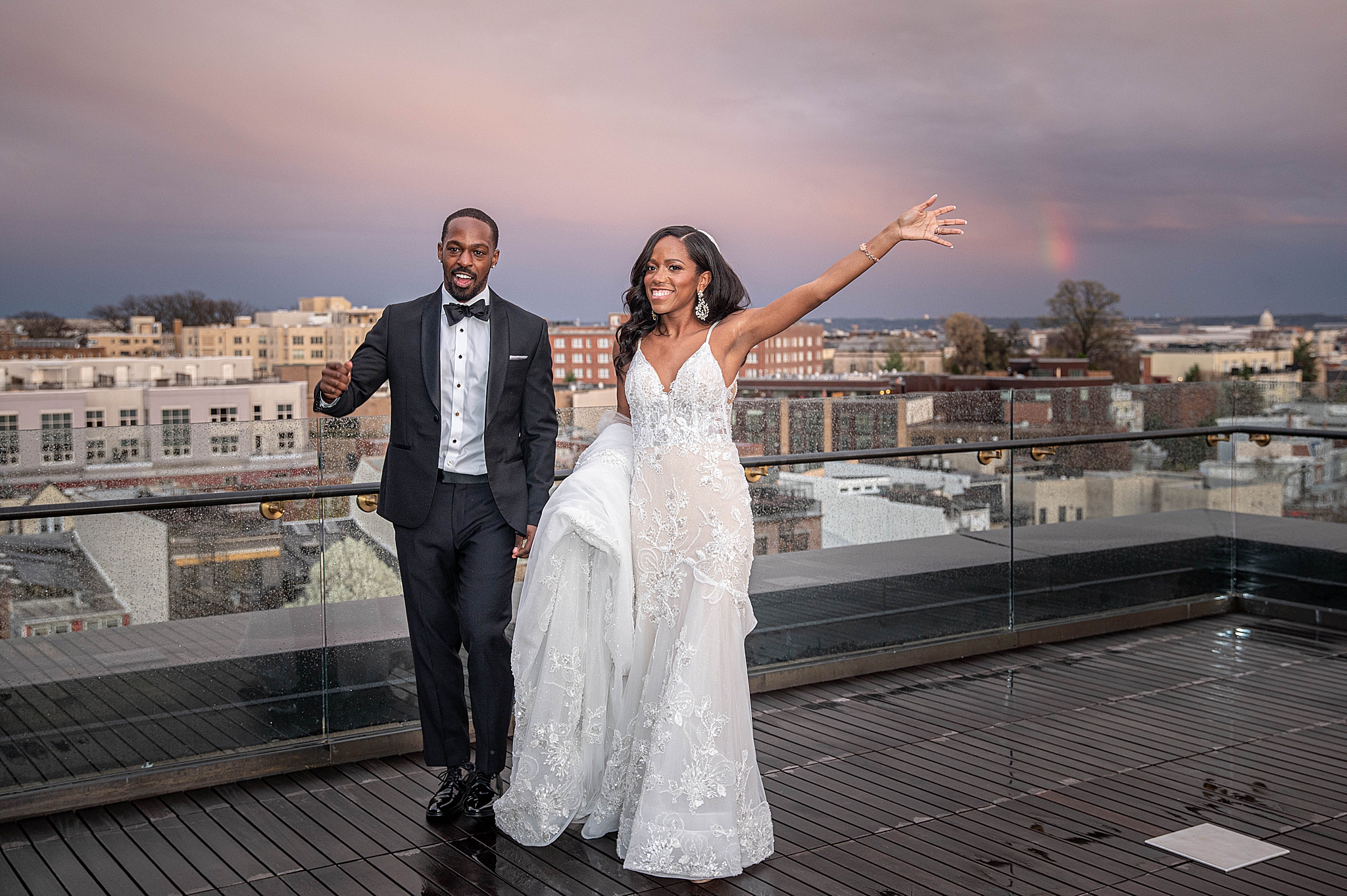 bride and groom walk on roof of LINE DC at sunset