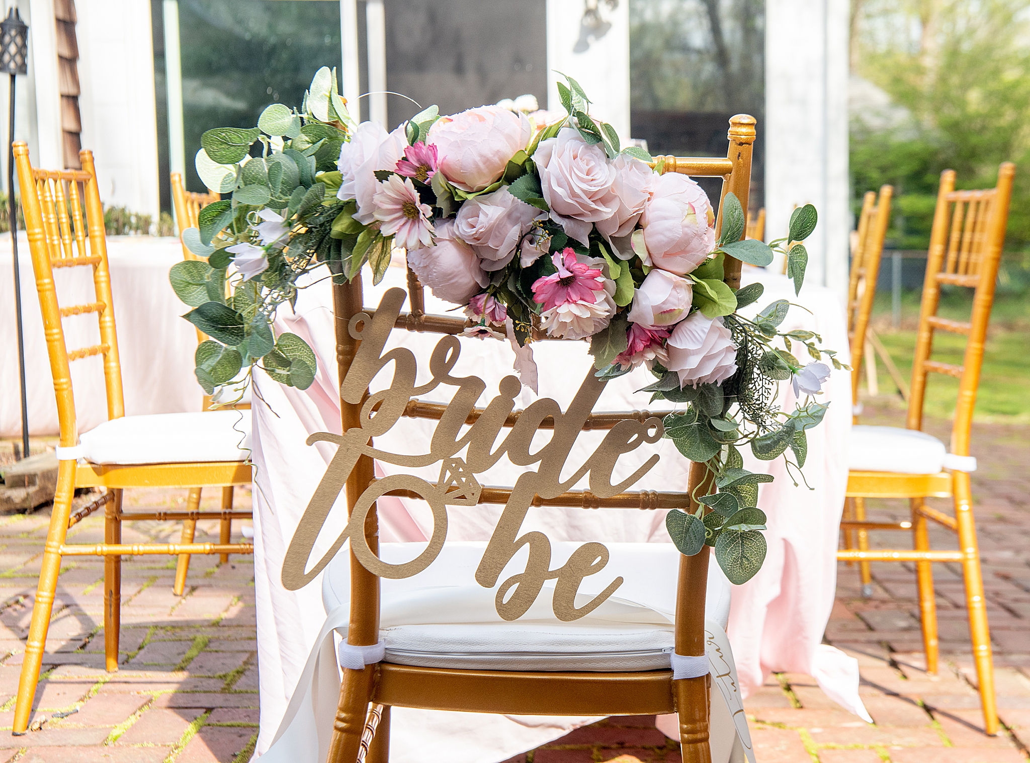 chair with bride to be sign and flowers