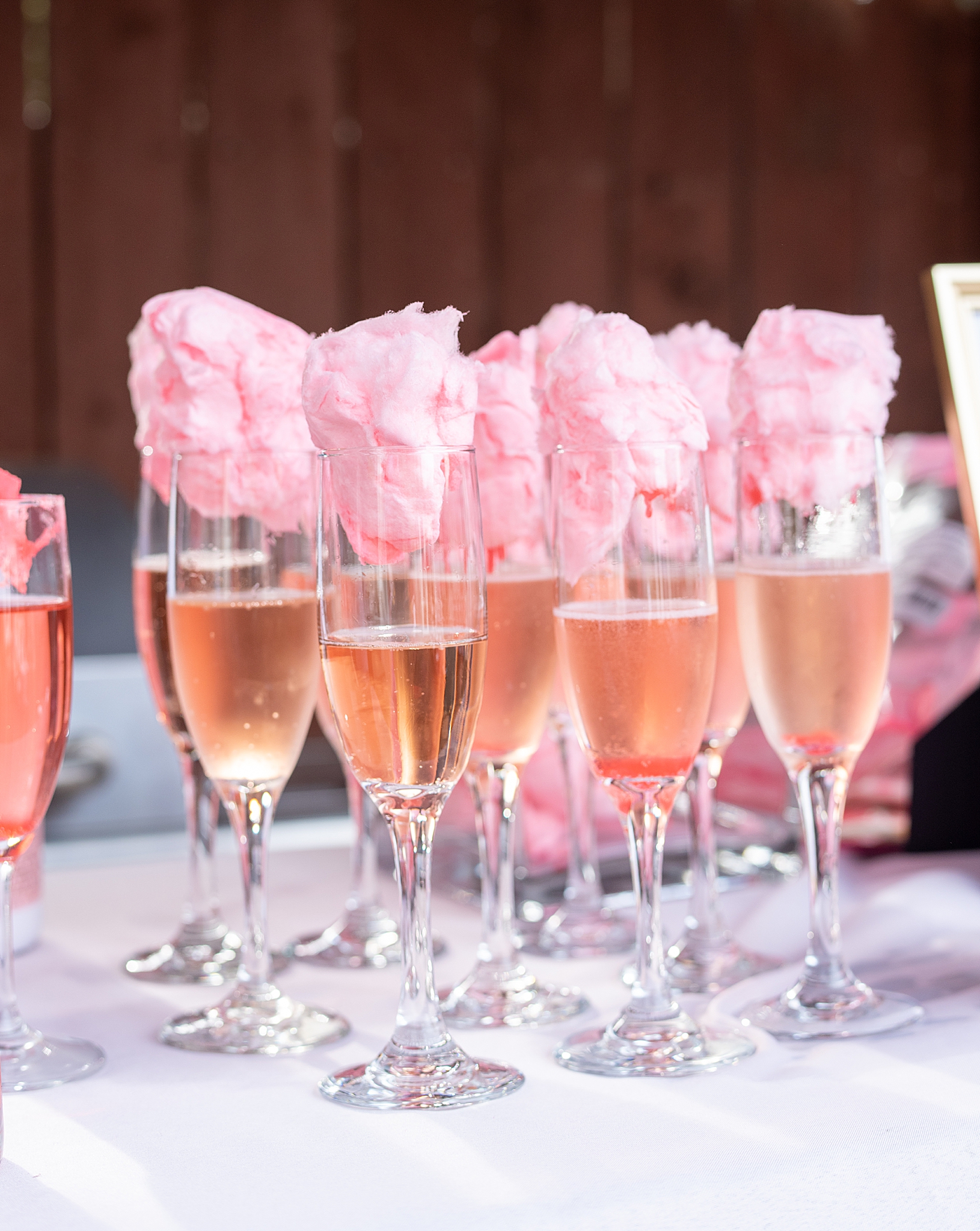 signature drink with pink champagne and cotton candy