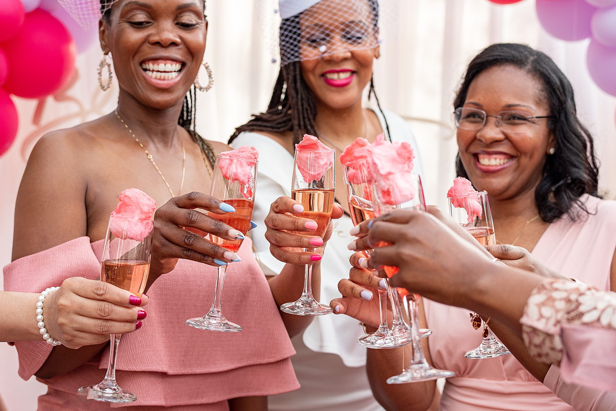 bride toasts champagne with cotton candy