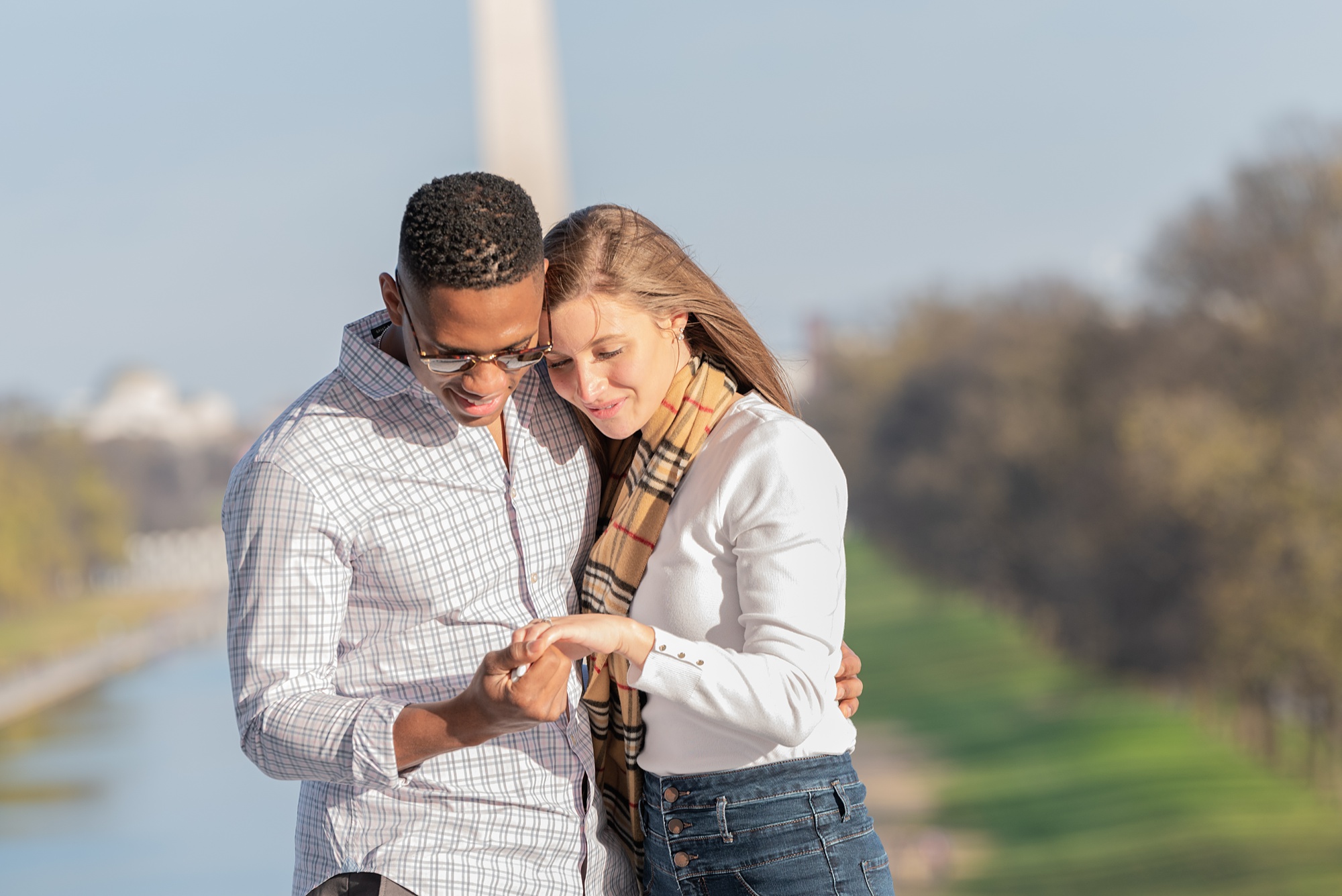 couple looks at engagement ring in Washington DC