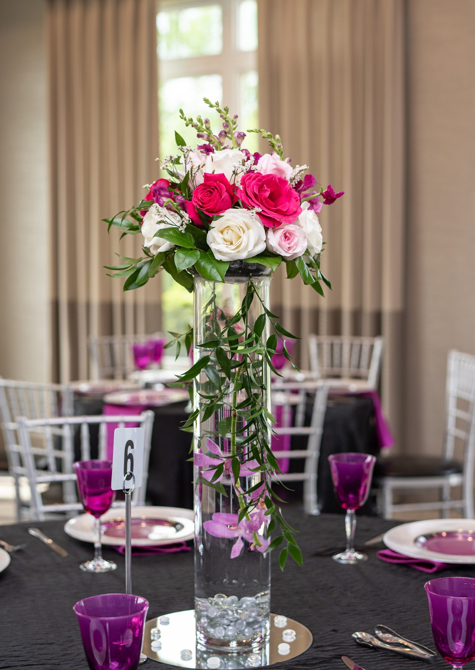 tall floral centerpiece with pink roses