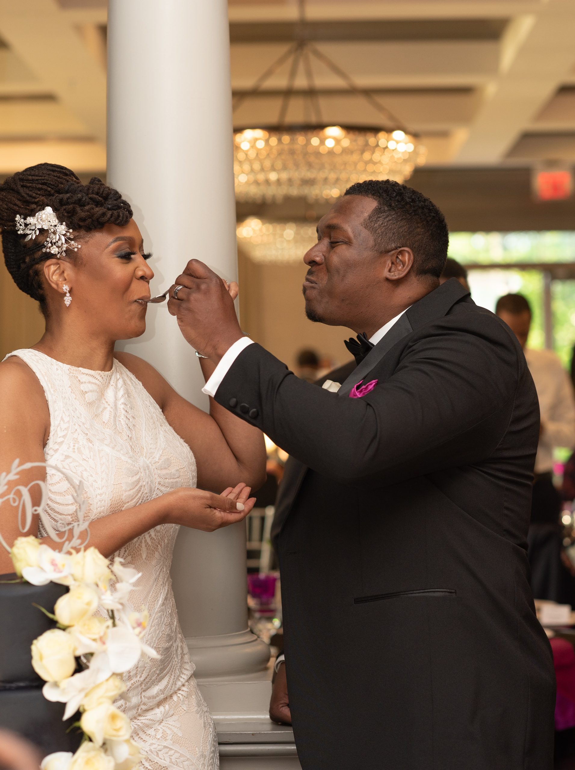groom kisses bride during reception at Upper Marlboro Lake Presidential Golf Course