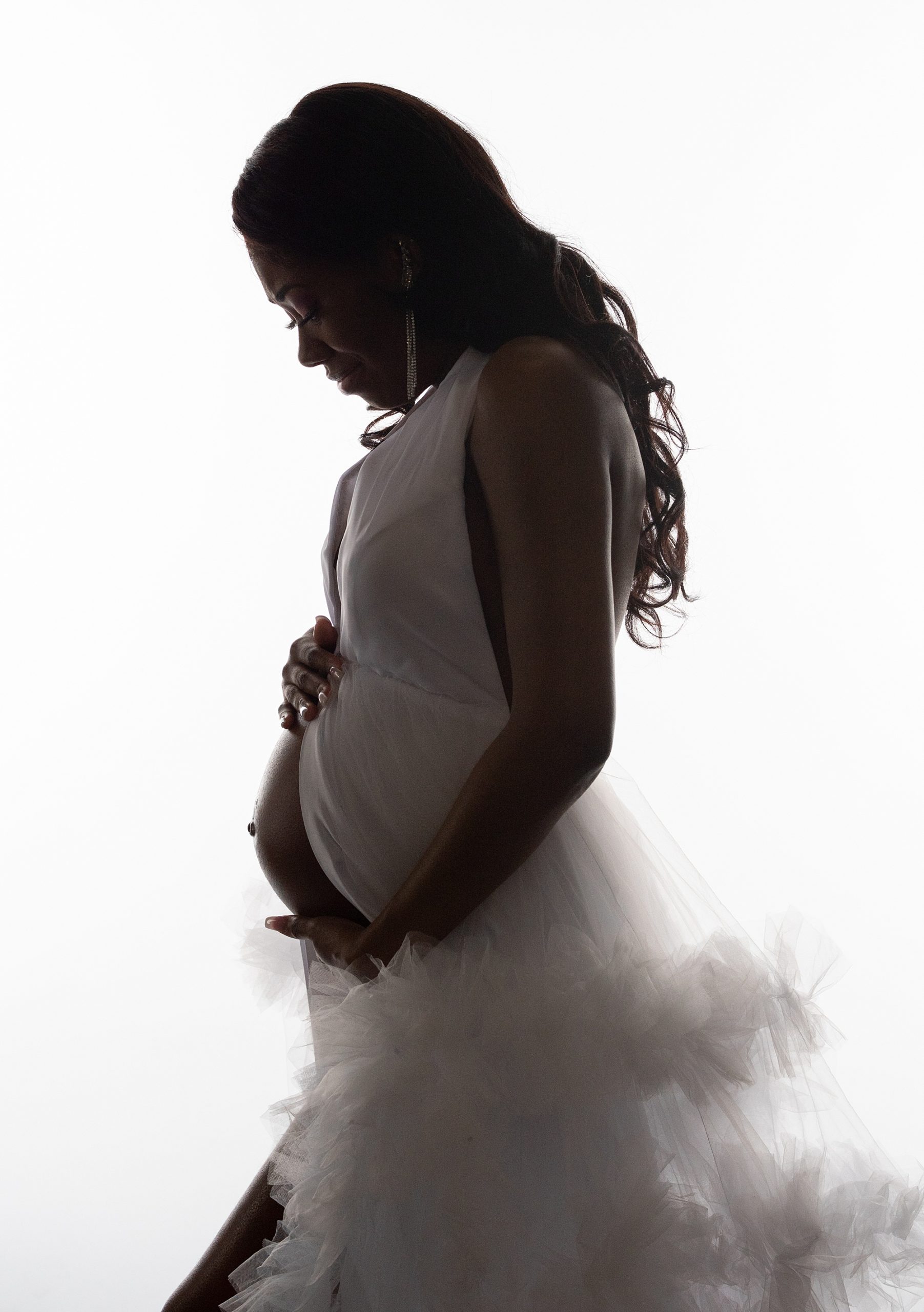 silhouette of mom-to-be during studio maternity session