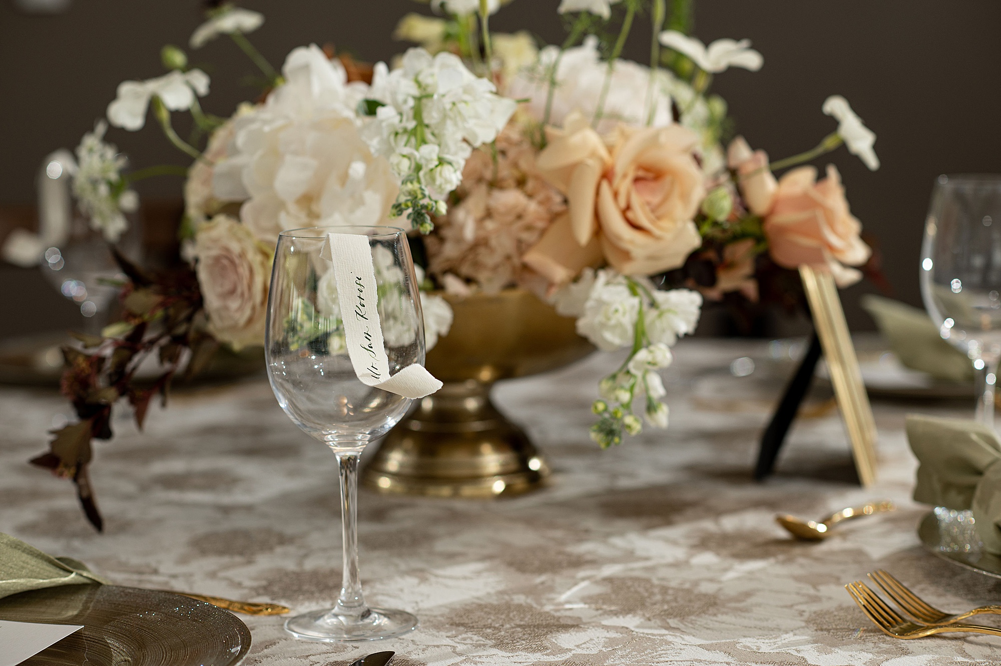 elegant floral display with wine glasses 