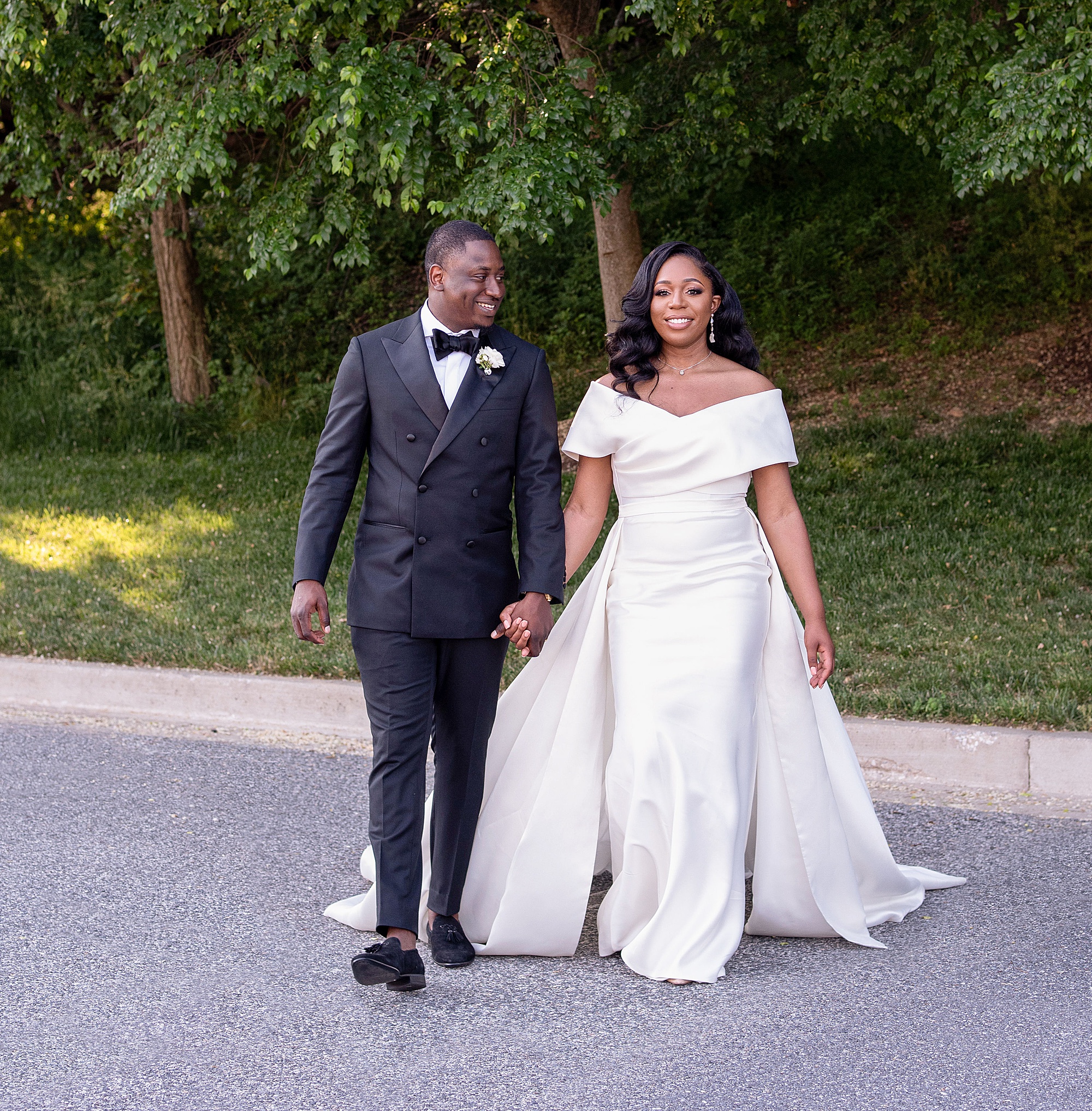 newlyweds walk during Baltimore MD wedding photos