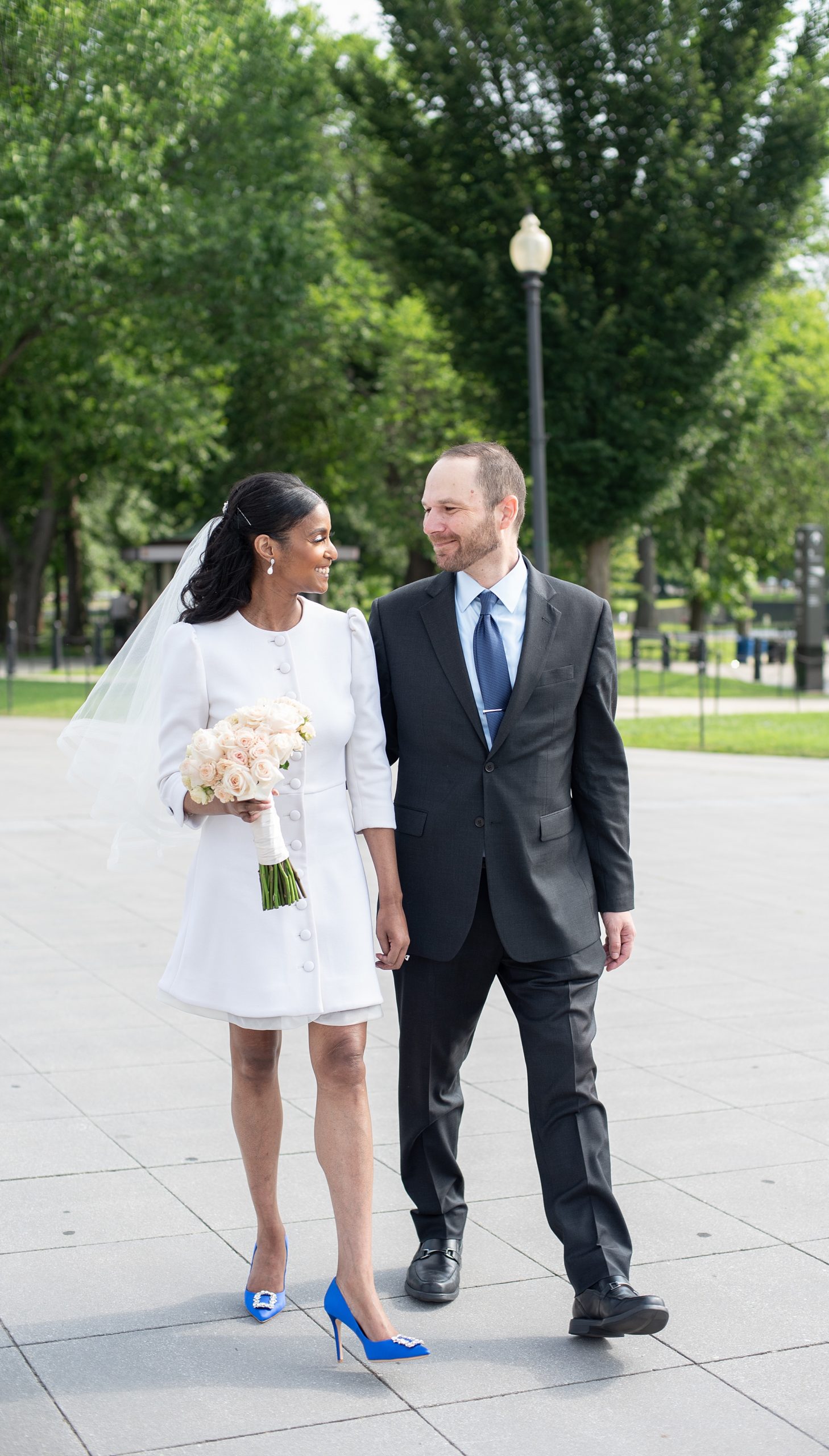 newlyweds walk by Lincoln Memorial before wedding ceremony