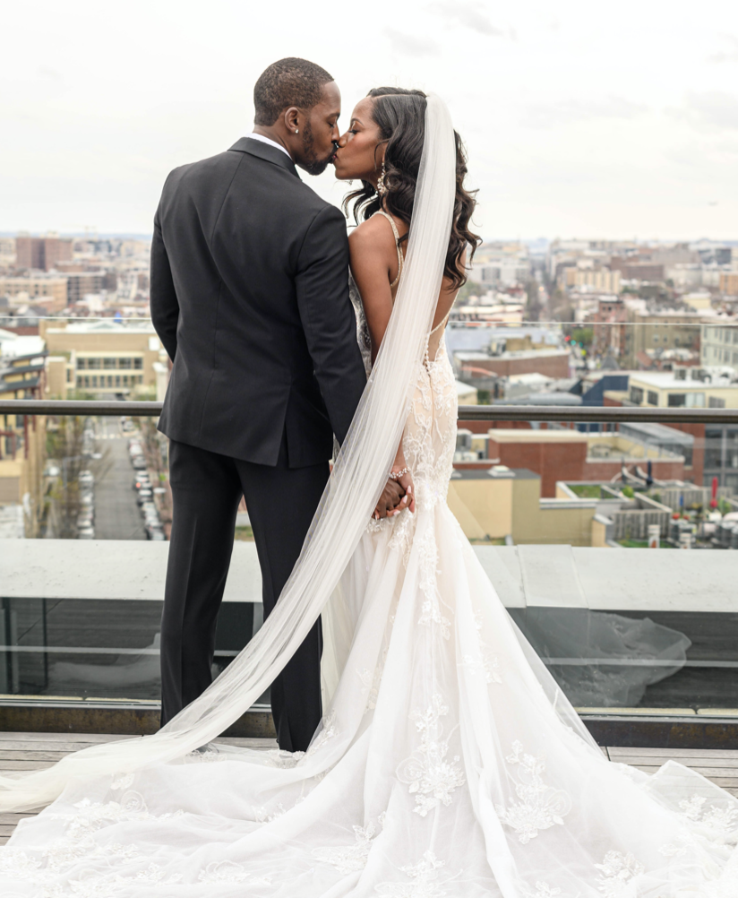 couple kisses on rooftop in Washington DC