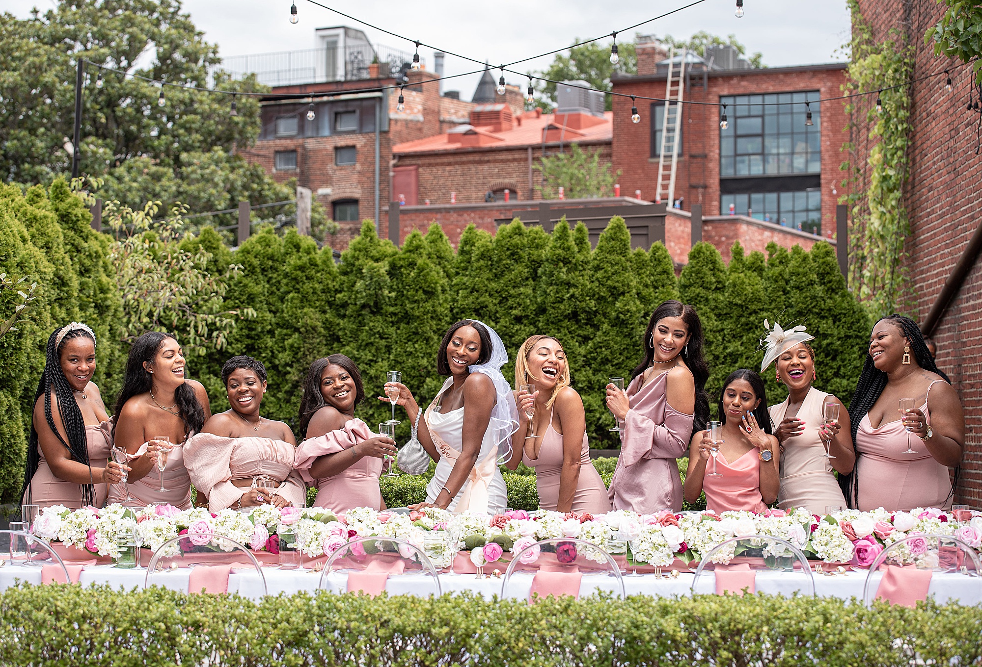 bride and bridesmaids pose during bridal shower in DC