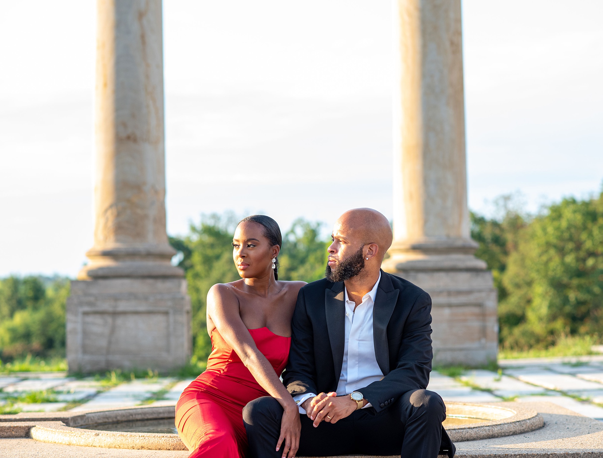 couple sits together during DC engagement photos at National Arboretum