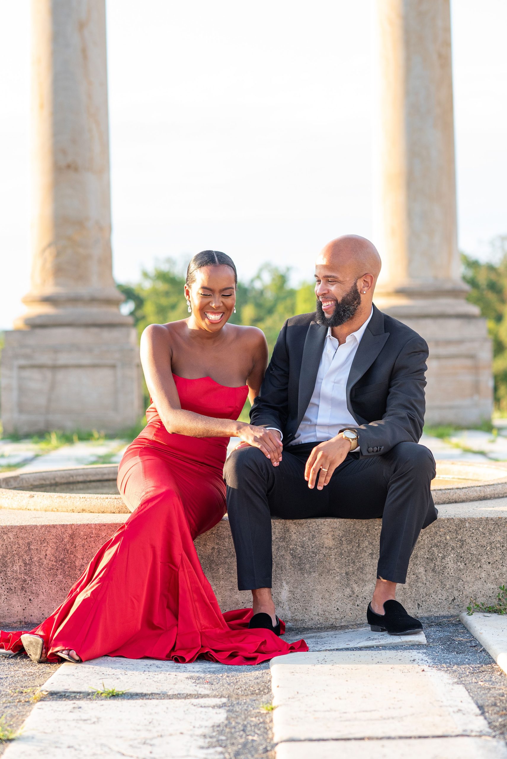 engaged couple laughs during National Arboretum engagement session