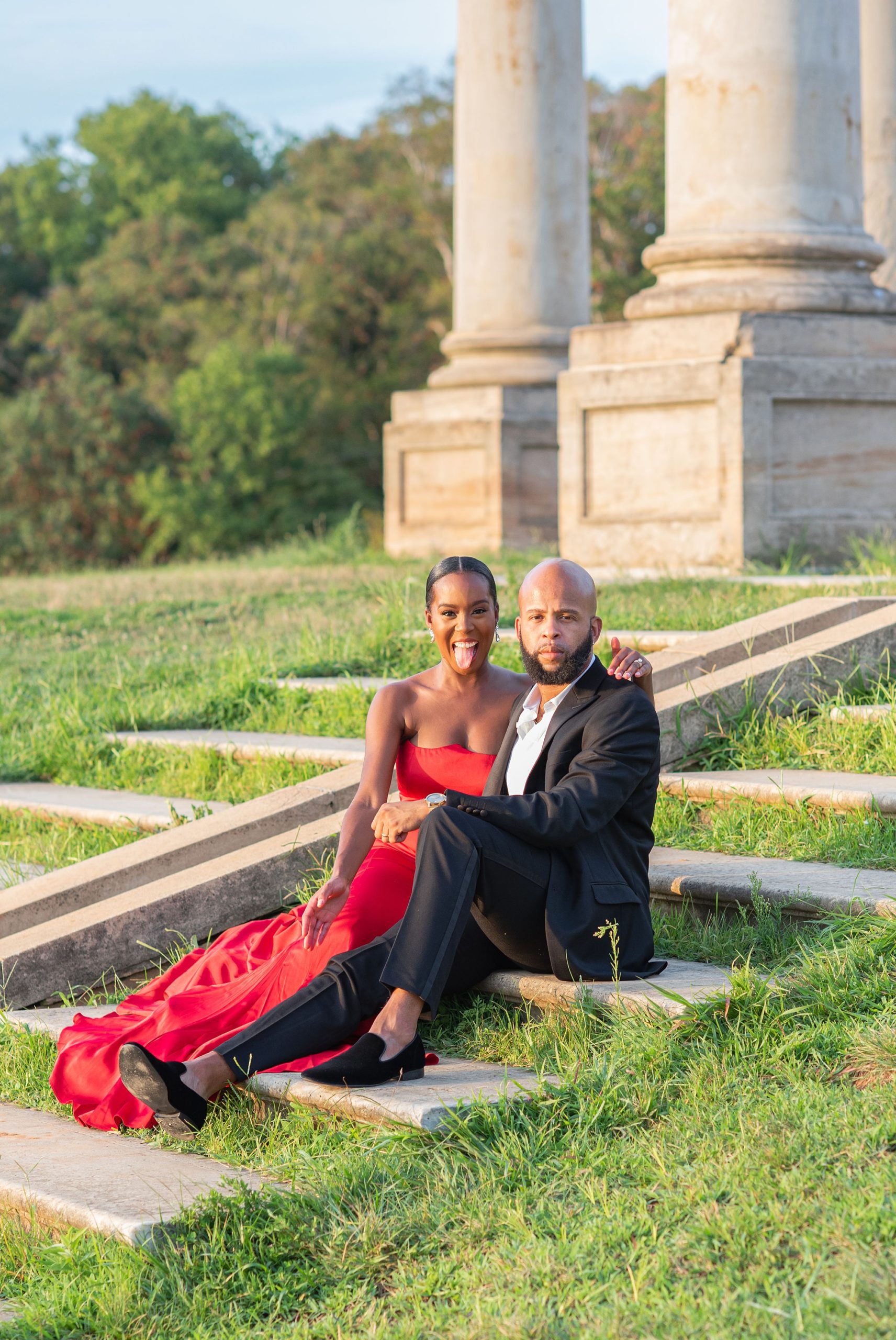 bride and groom sit on steps of National Arboretum