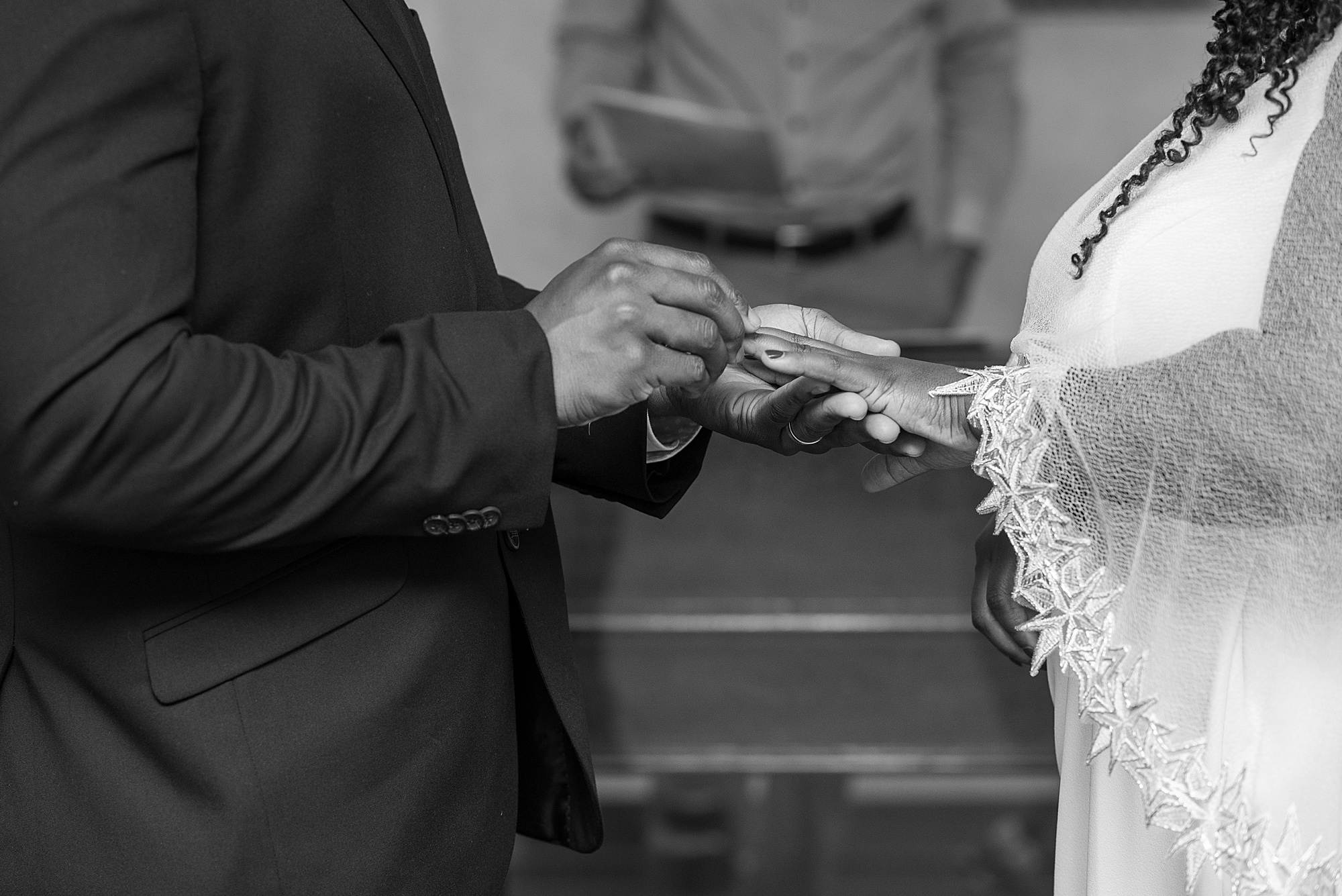 bride and groom exchange rings during courthouse elopement 