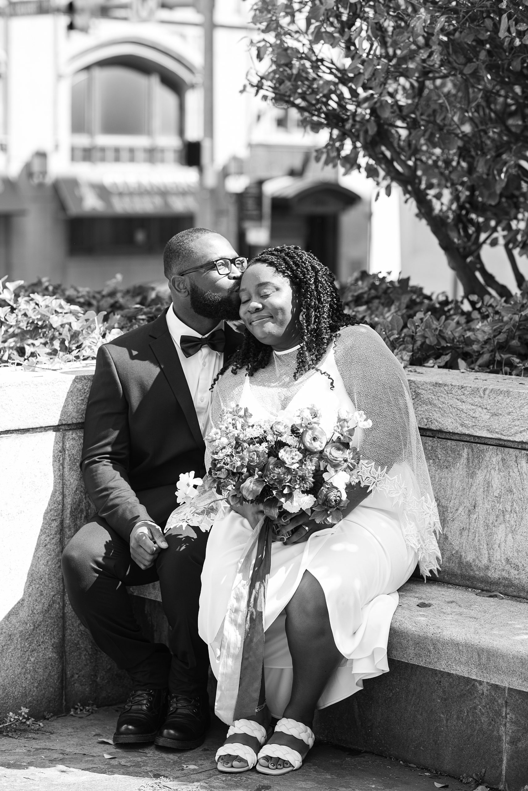 groom kisses bride's forehead in Baltimore MD