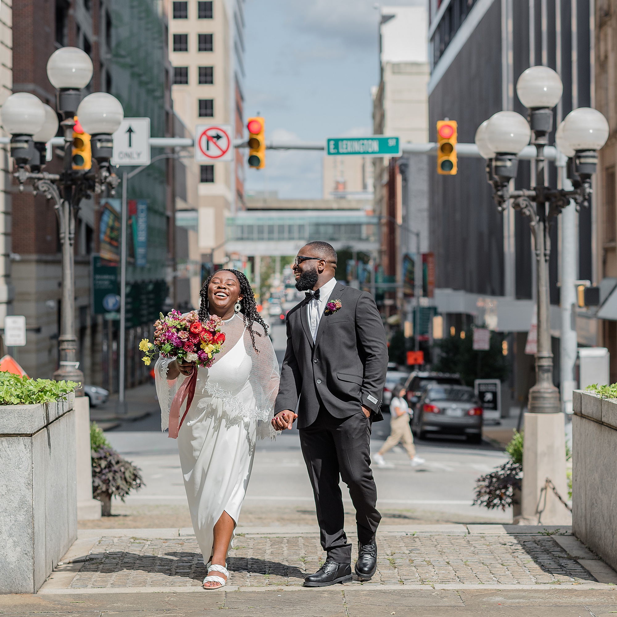 newlyweds walk through Baltimore MD streets