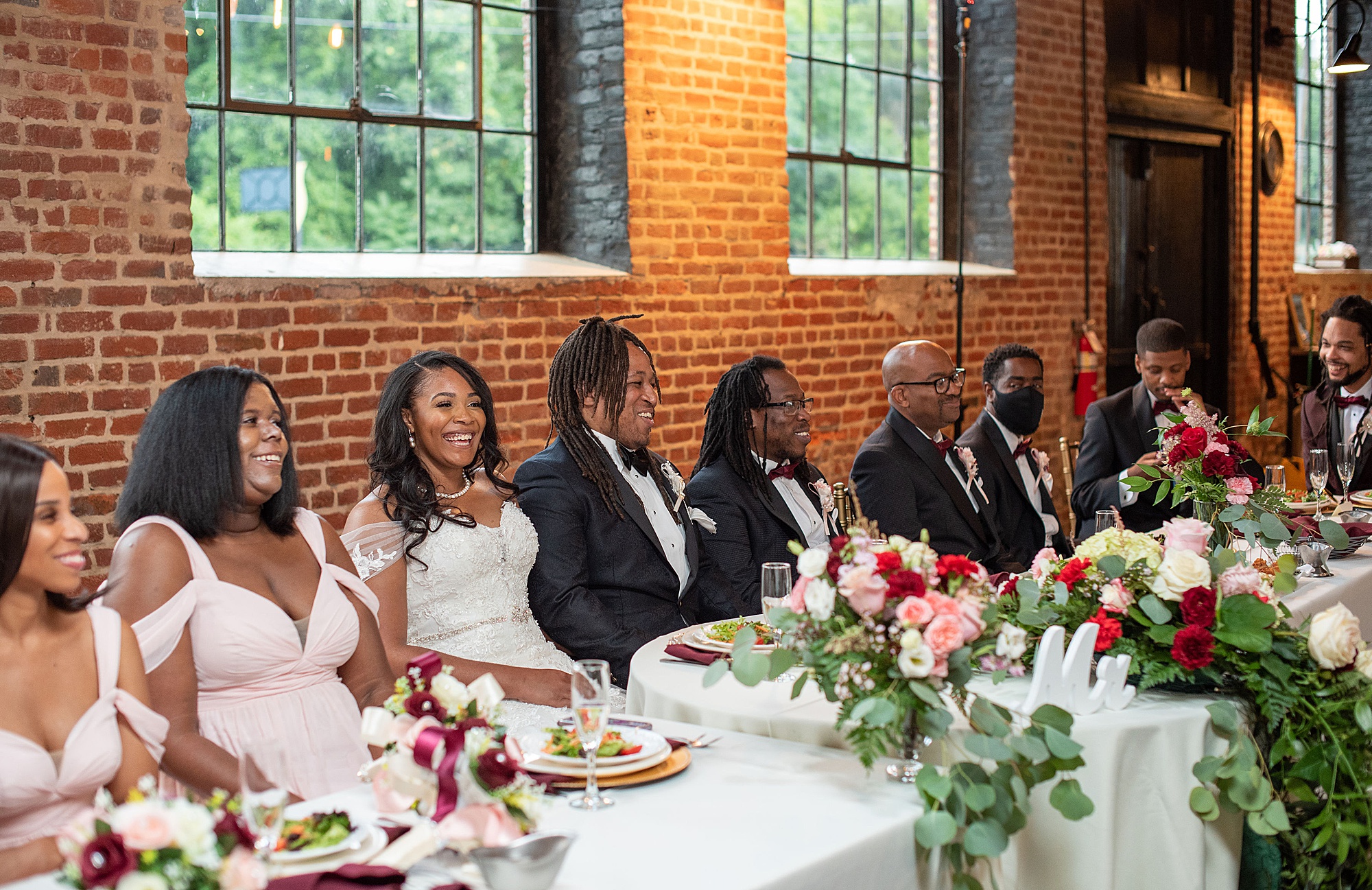 couple sits at head table during VA wedding reception