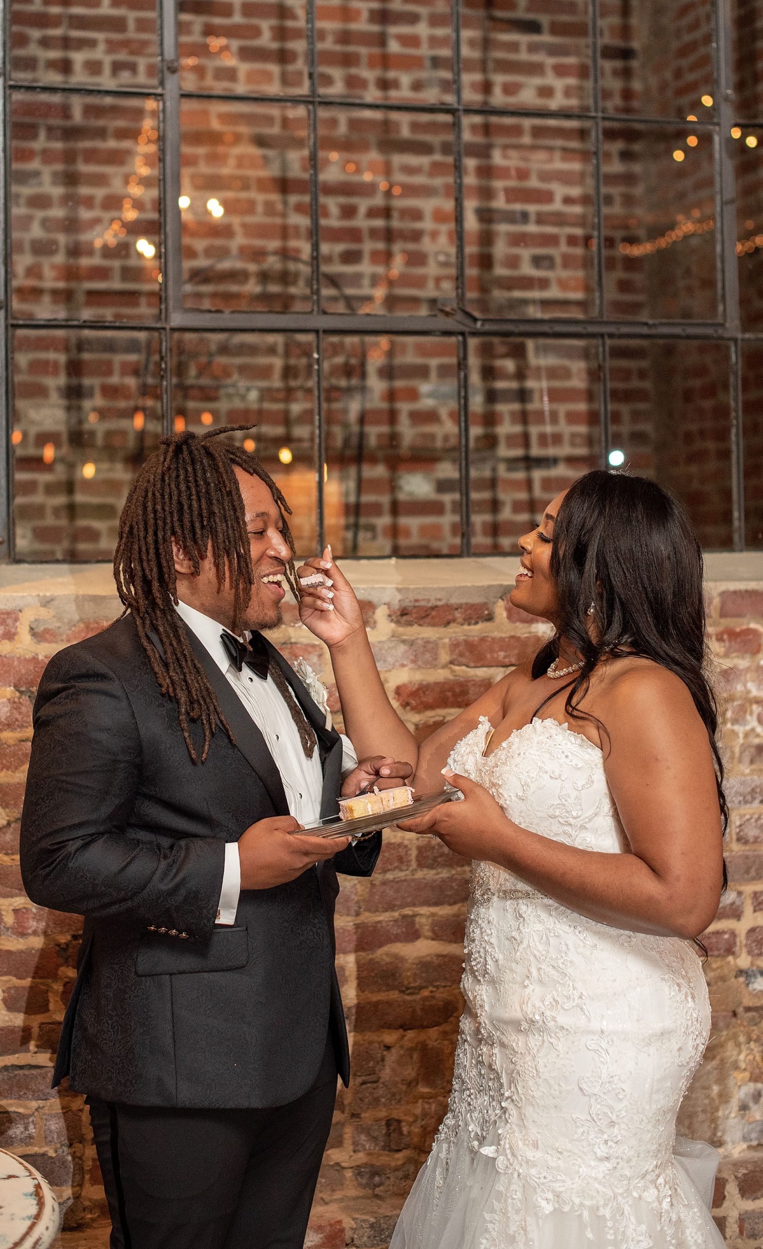 couple eats cake during VA wedding reception
