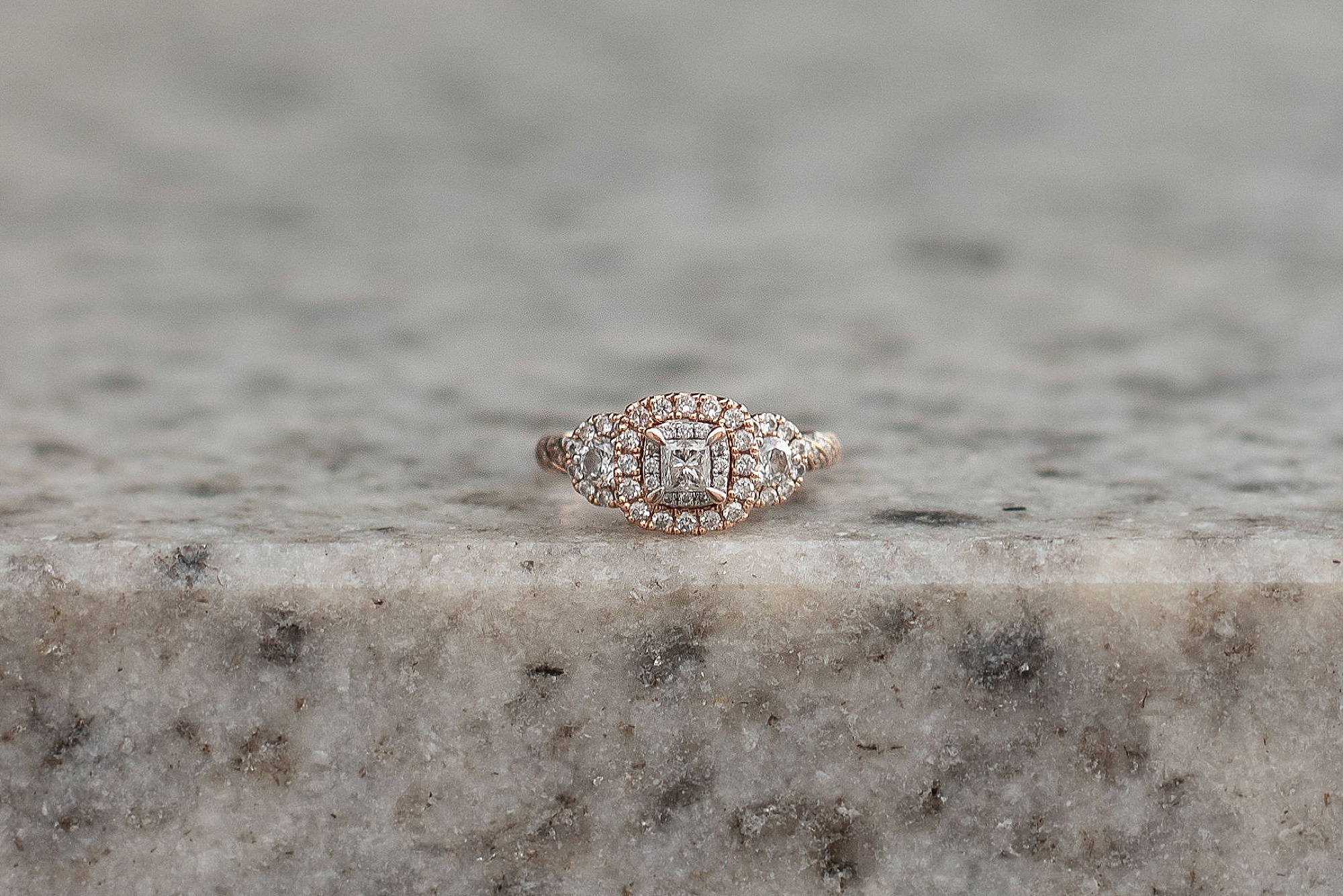 engagement ring on concrete step