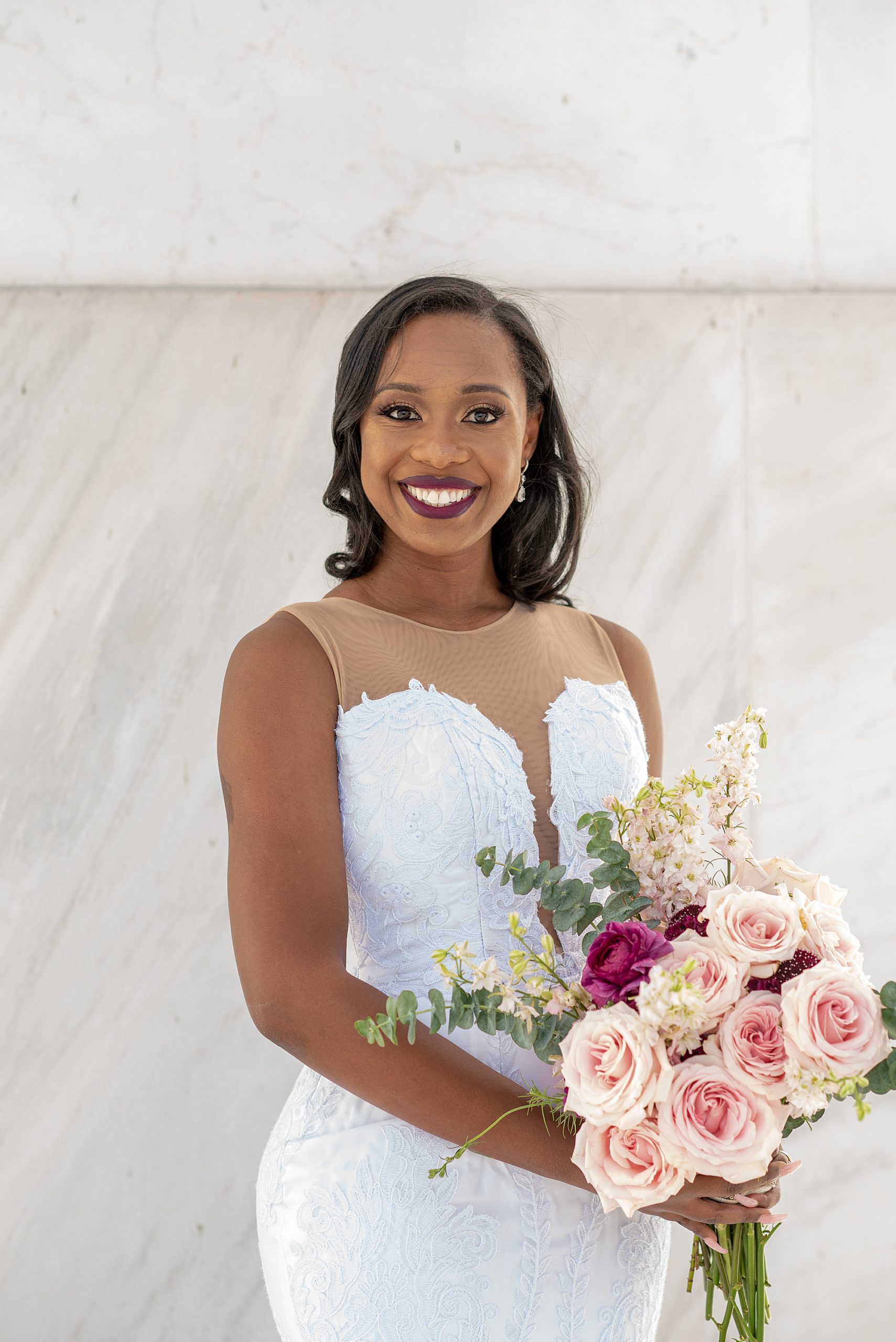 DMV bride smiles during Lincoln Memorial bridal portraits