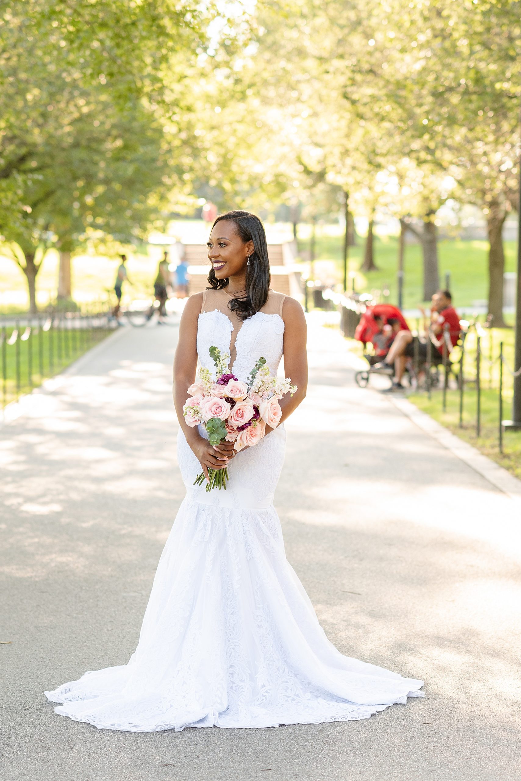 bride holds bouquet of pink flowers in Washington DC
