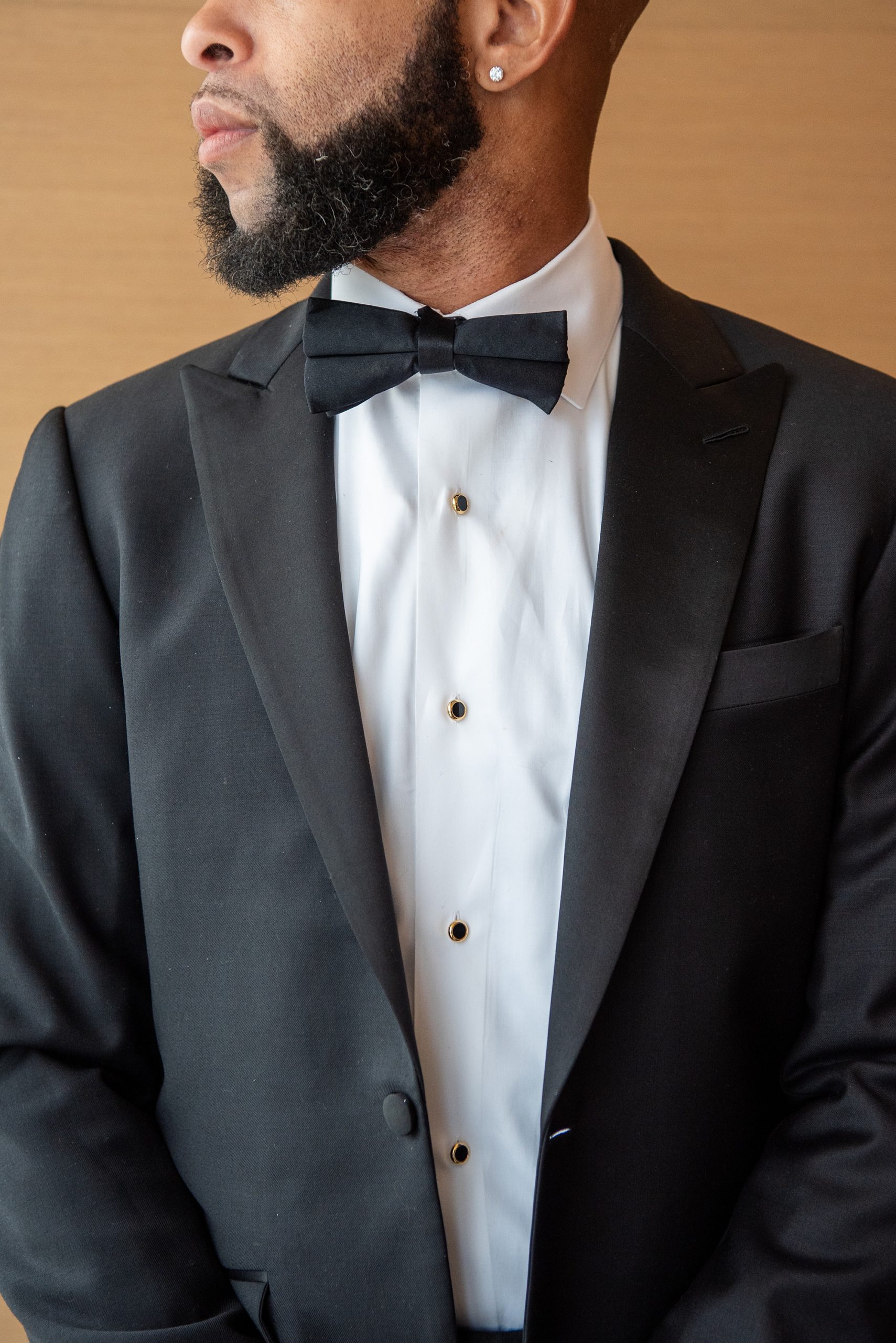 groom's classic suit with gold details for DC wedding
