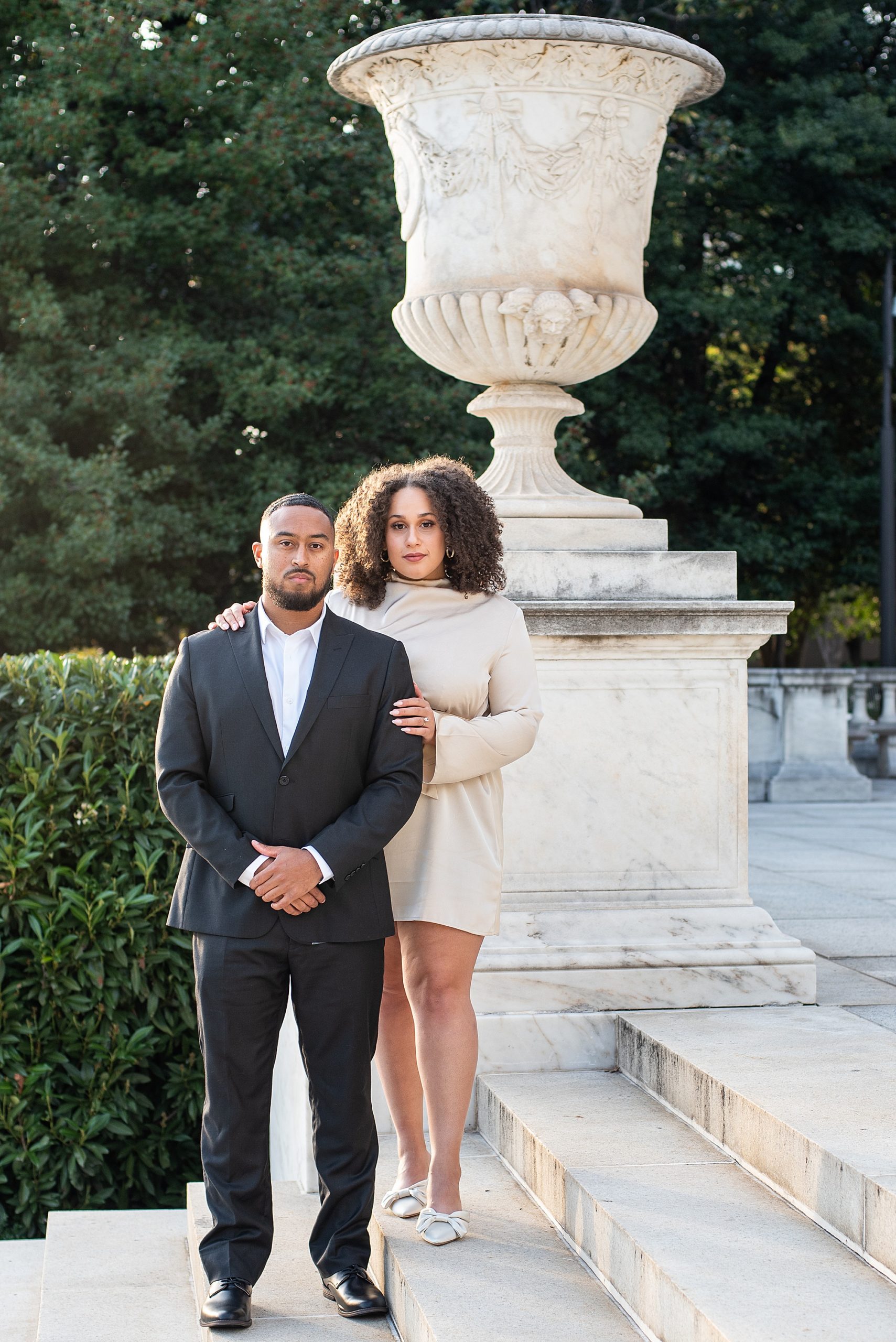 bride and groom stand on steps outside the American Pharmacist Association