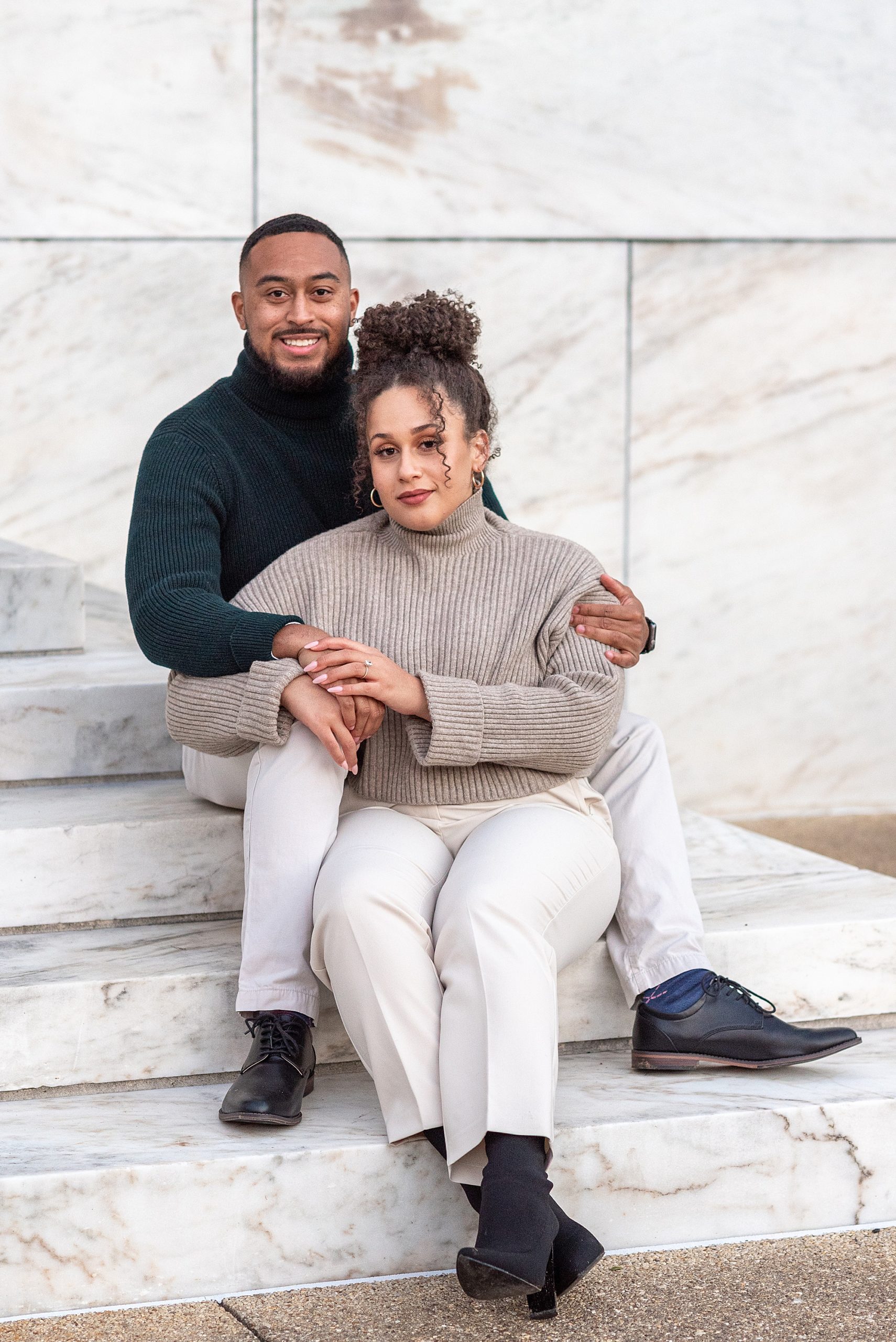 couple sits on steps during DC photos