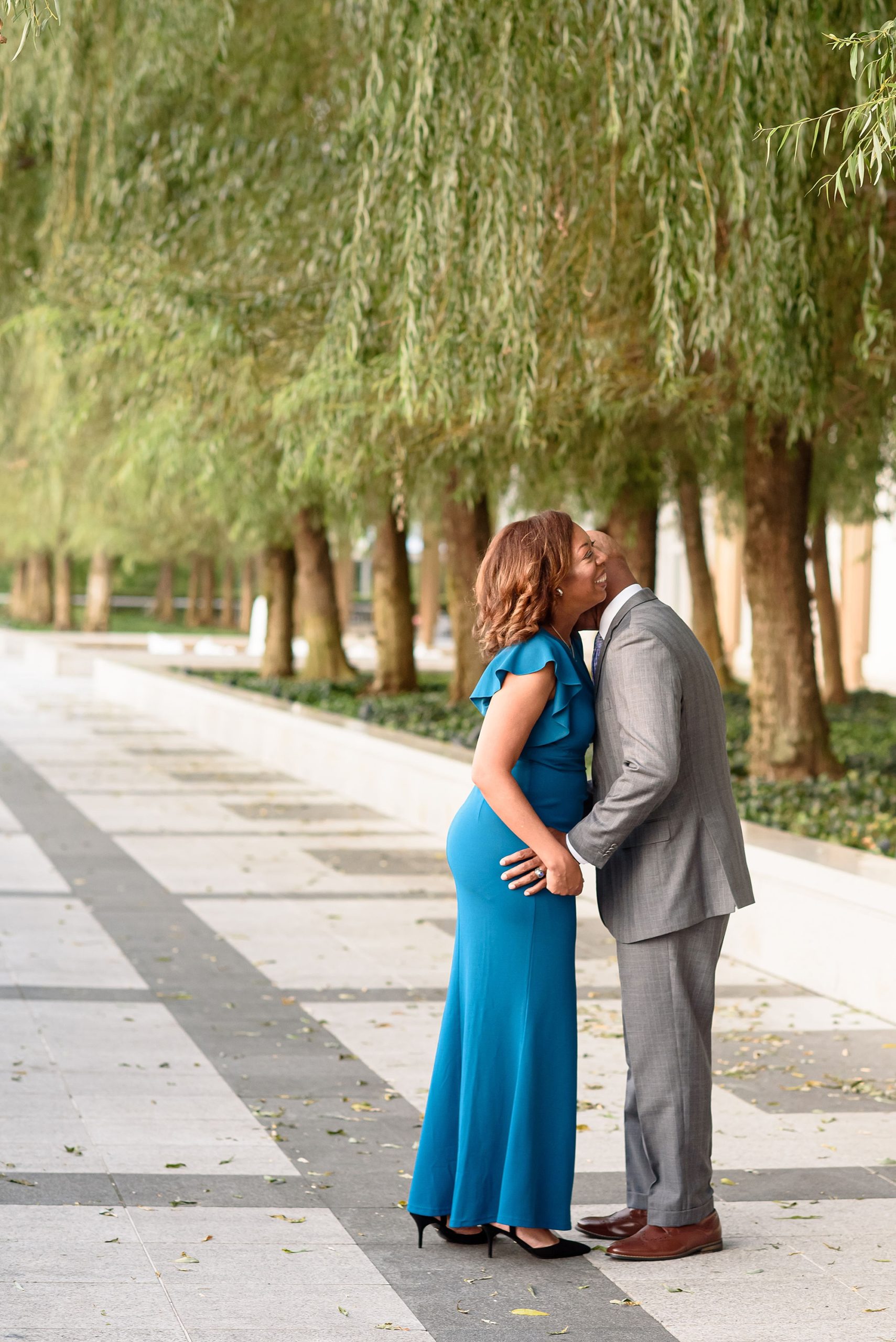 bride and groom laugh together during Kennedy Center engagement session
