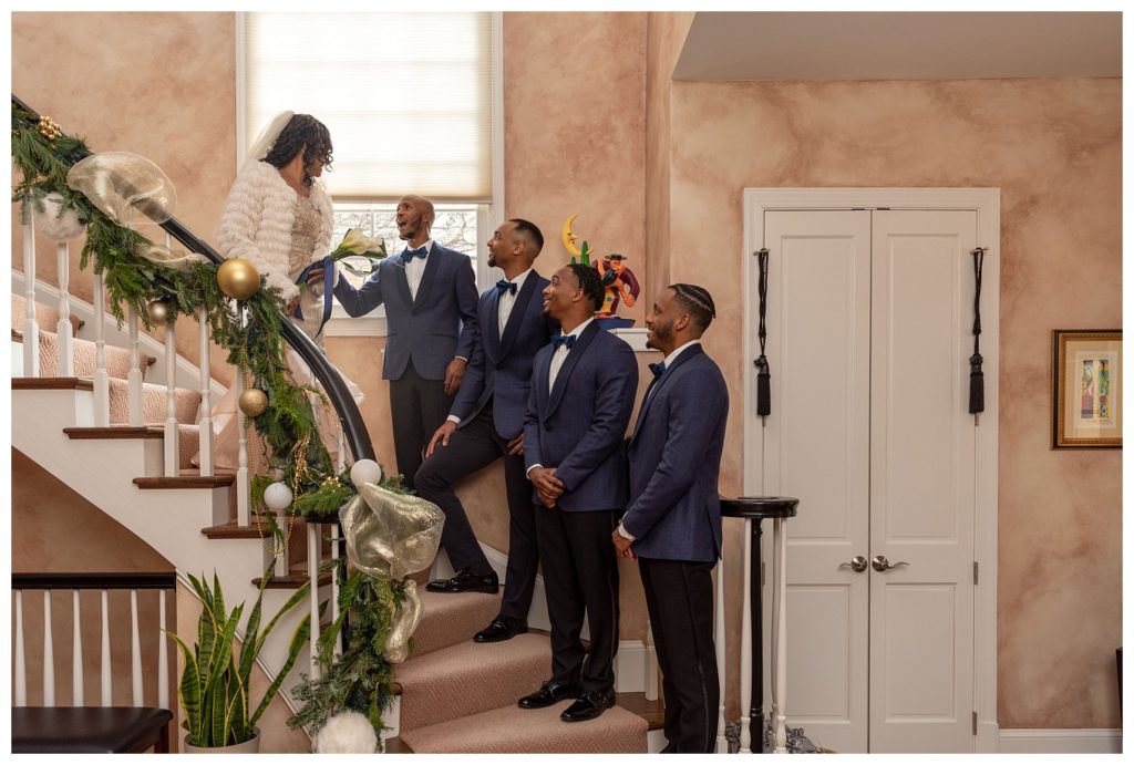 bride with groomsmen on the stairs during D.C elopement