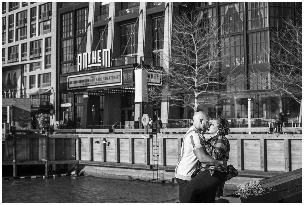 black and white photo od couple posing at the wharf in dc