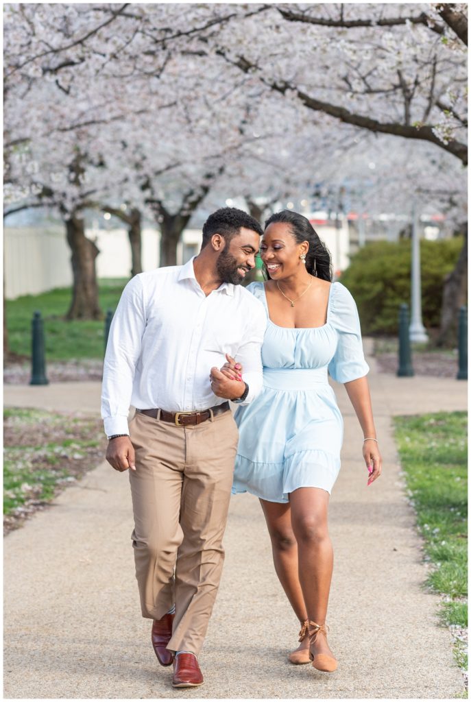 couple walking and laughing together outside in D.C.