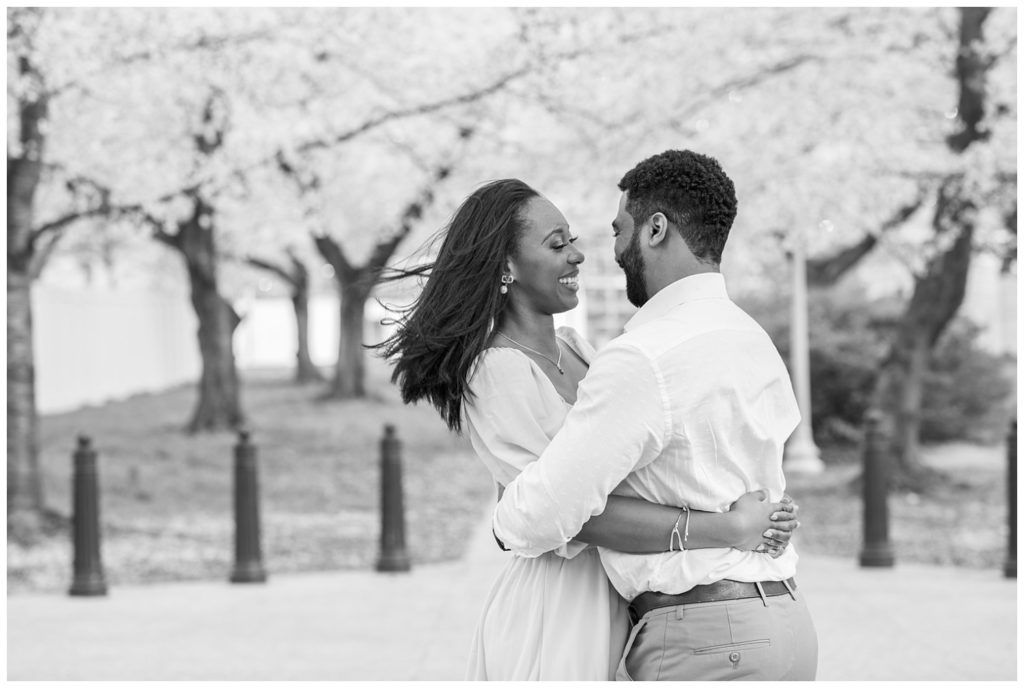 couple hugging and smiling for photos in Washington D.C.