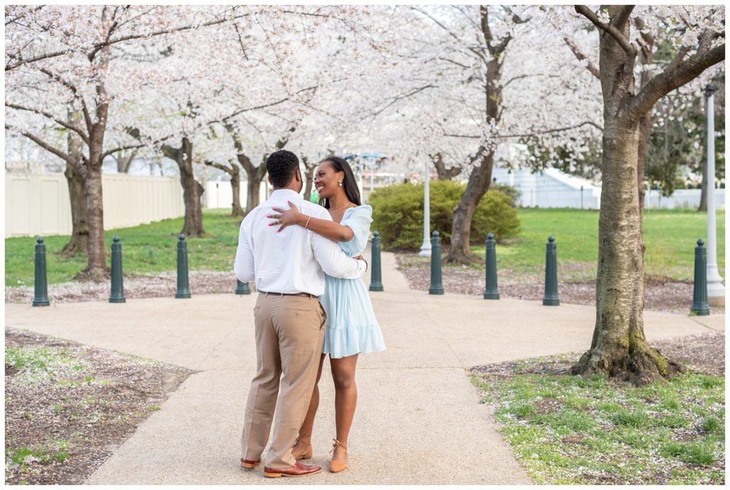 couple dancing outside under the cherry trees in Washington D.C.