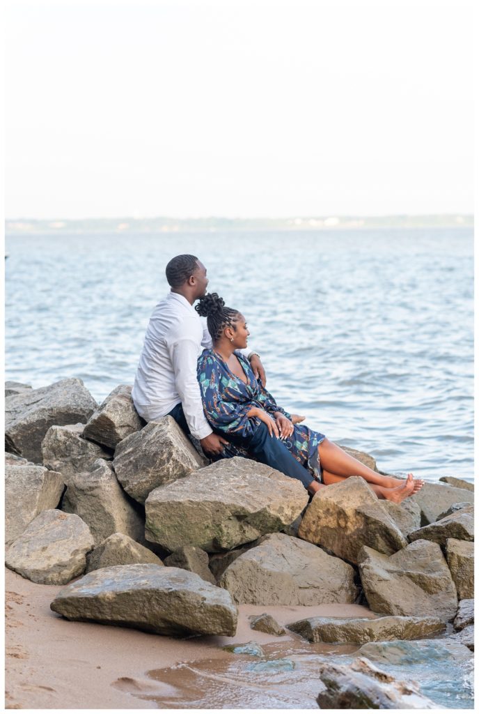 couple looking out over the water in Virginia engagement session