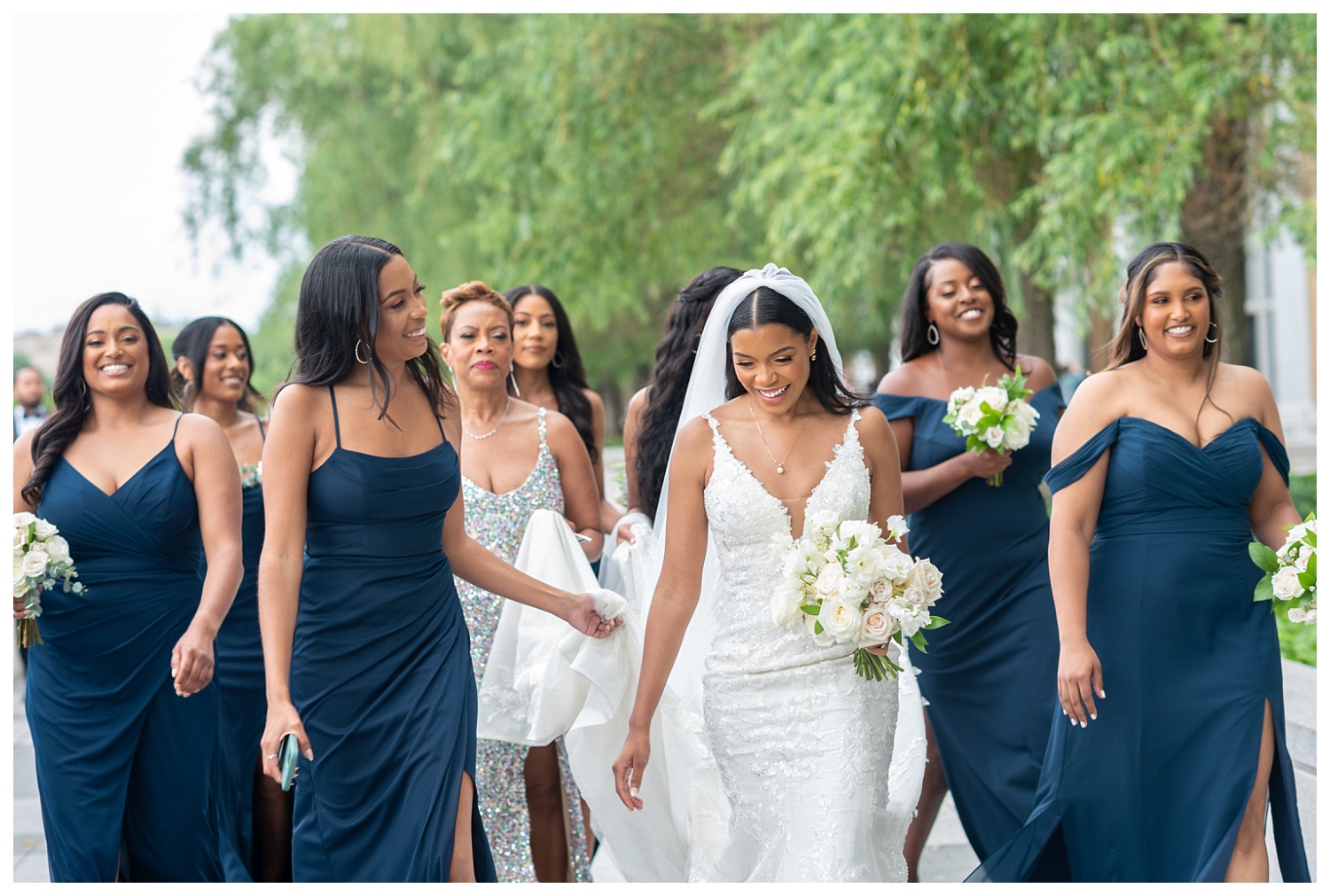 bride walking with her bridesmaids at the Kennedy Center in Washington, D.C. 