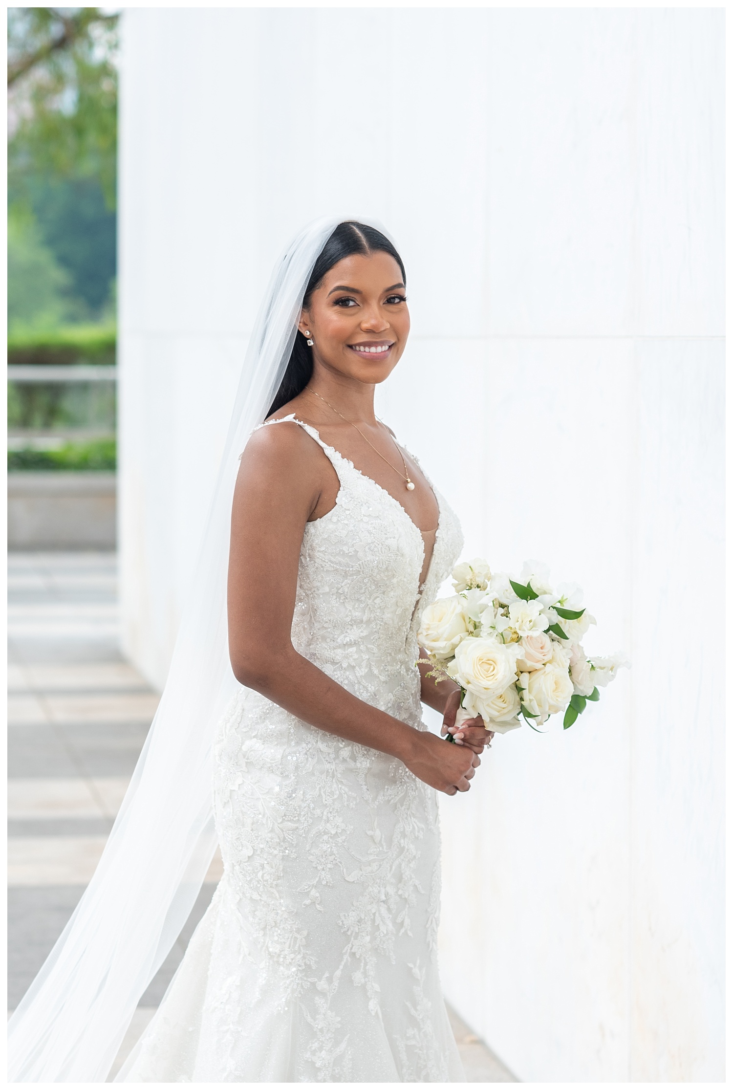 bride posing with her flowers at a summer wedding in Washington, D.C.