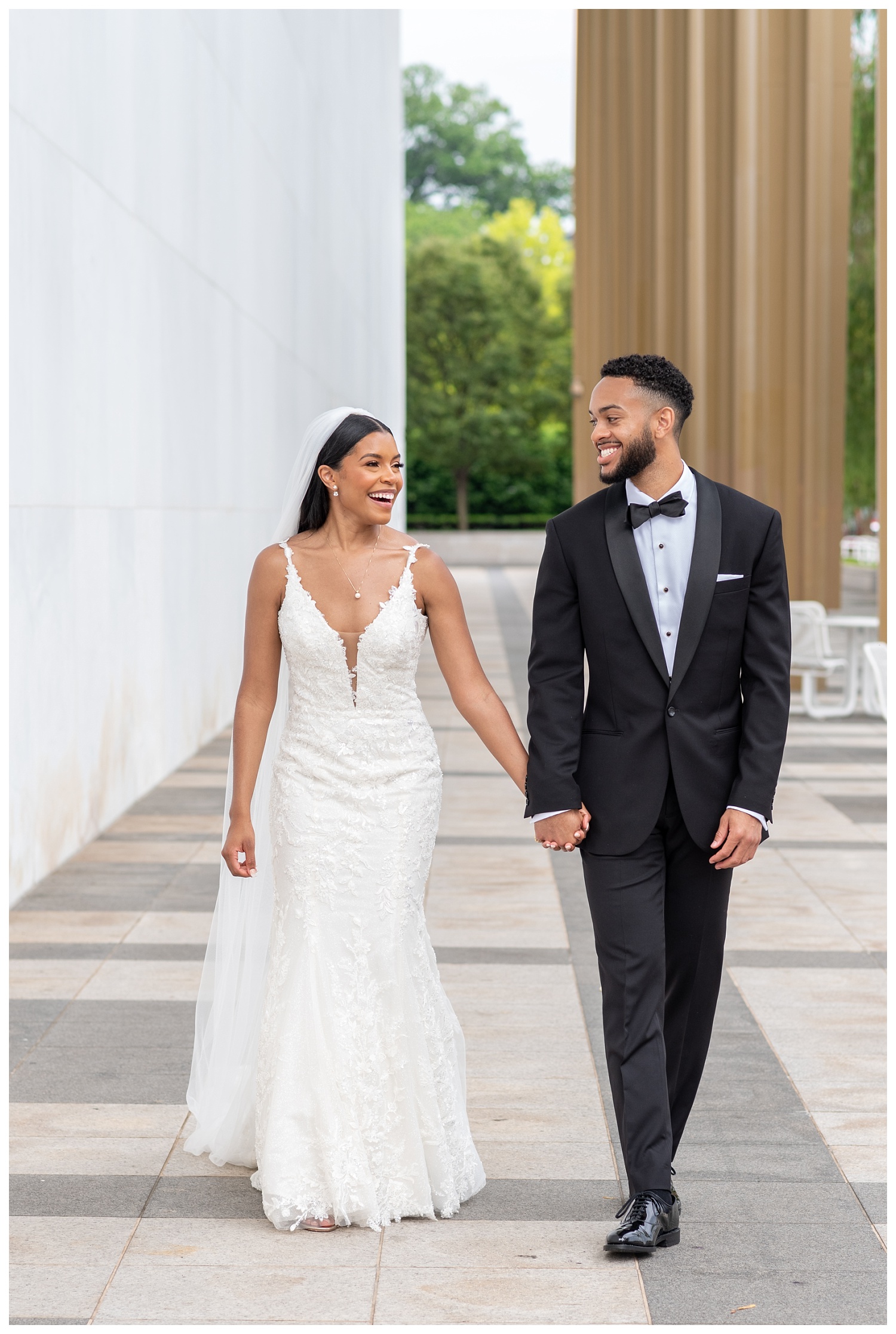 wedding couple holding hands and walking together in Washington, D.C.