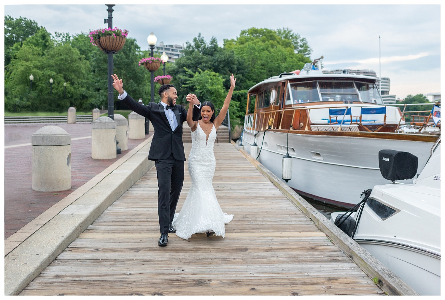 bride and groom celebrating along the water in Georgetown