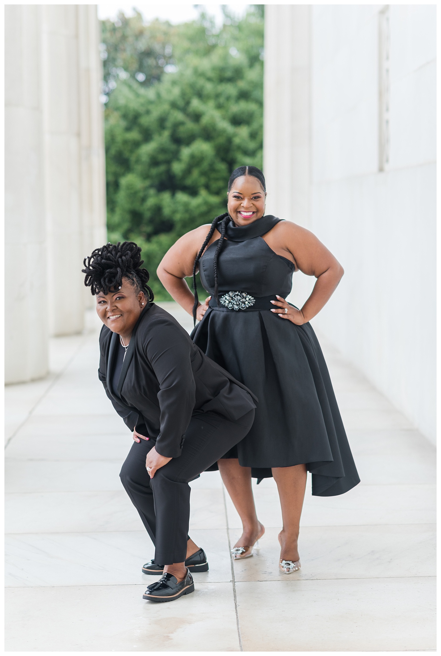 female couple posing at Lincoln Memorial engagement session