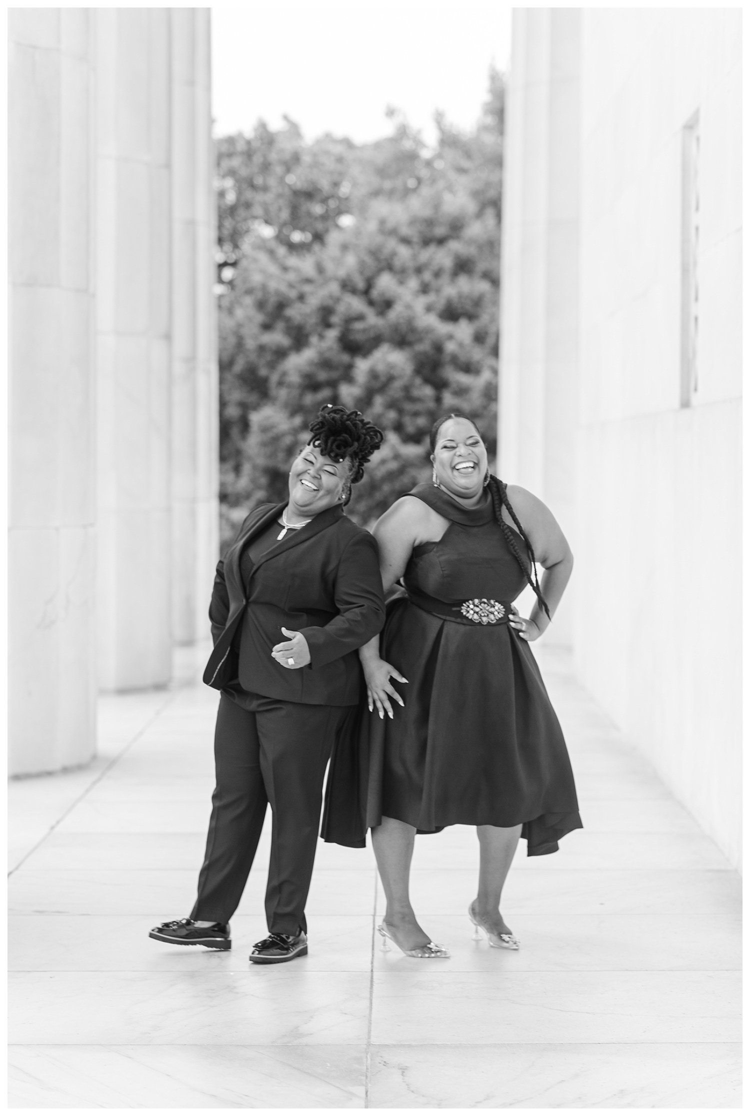 female couple posing at Lincoln Memorial engagement session