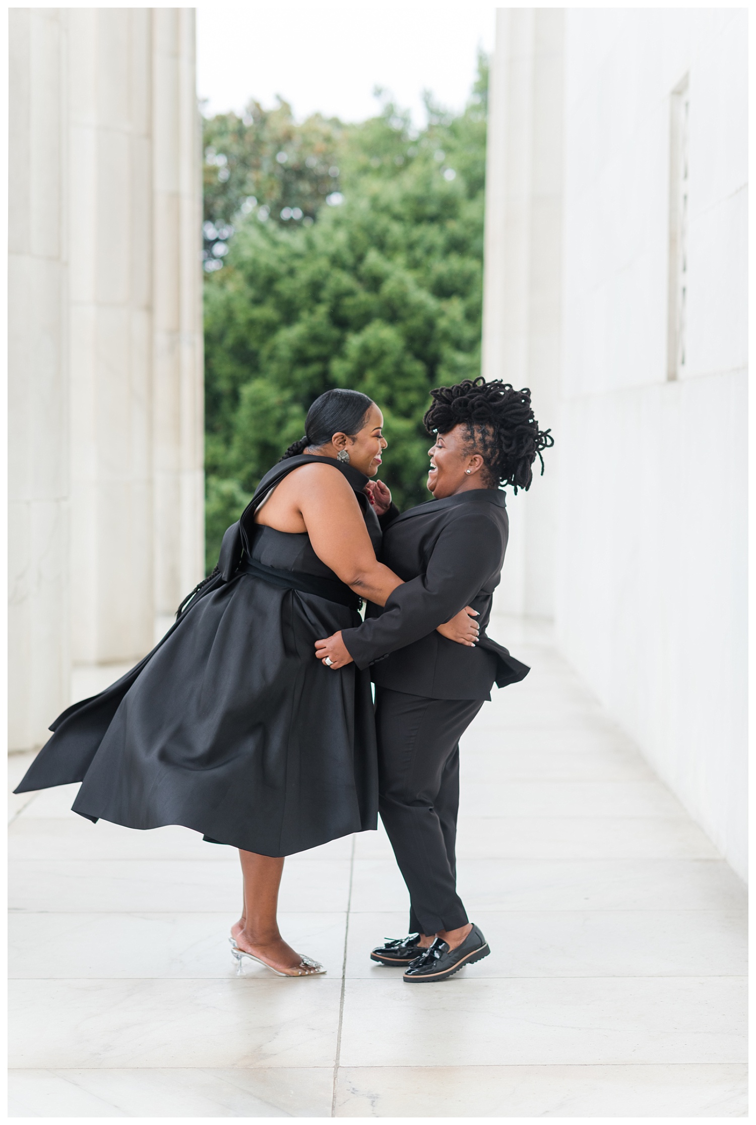 couple laughing with each other at Washington, D.C. engagement session