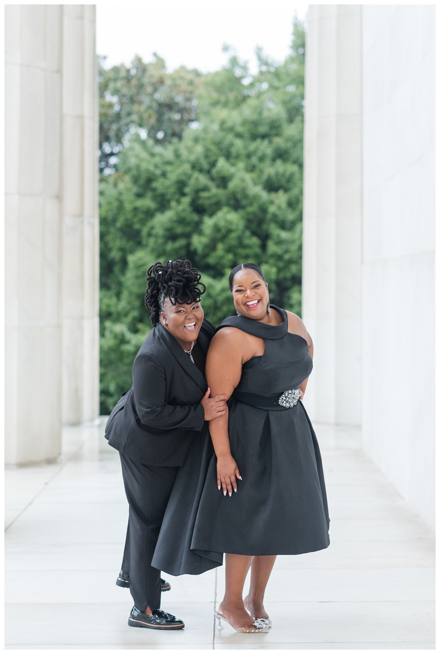 couple laughing with each other at Washington, D.C. engagement session