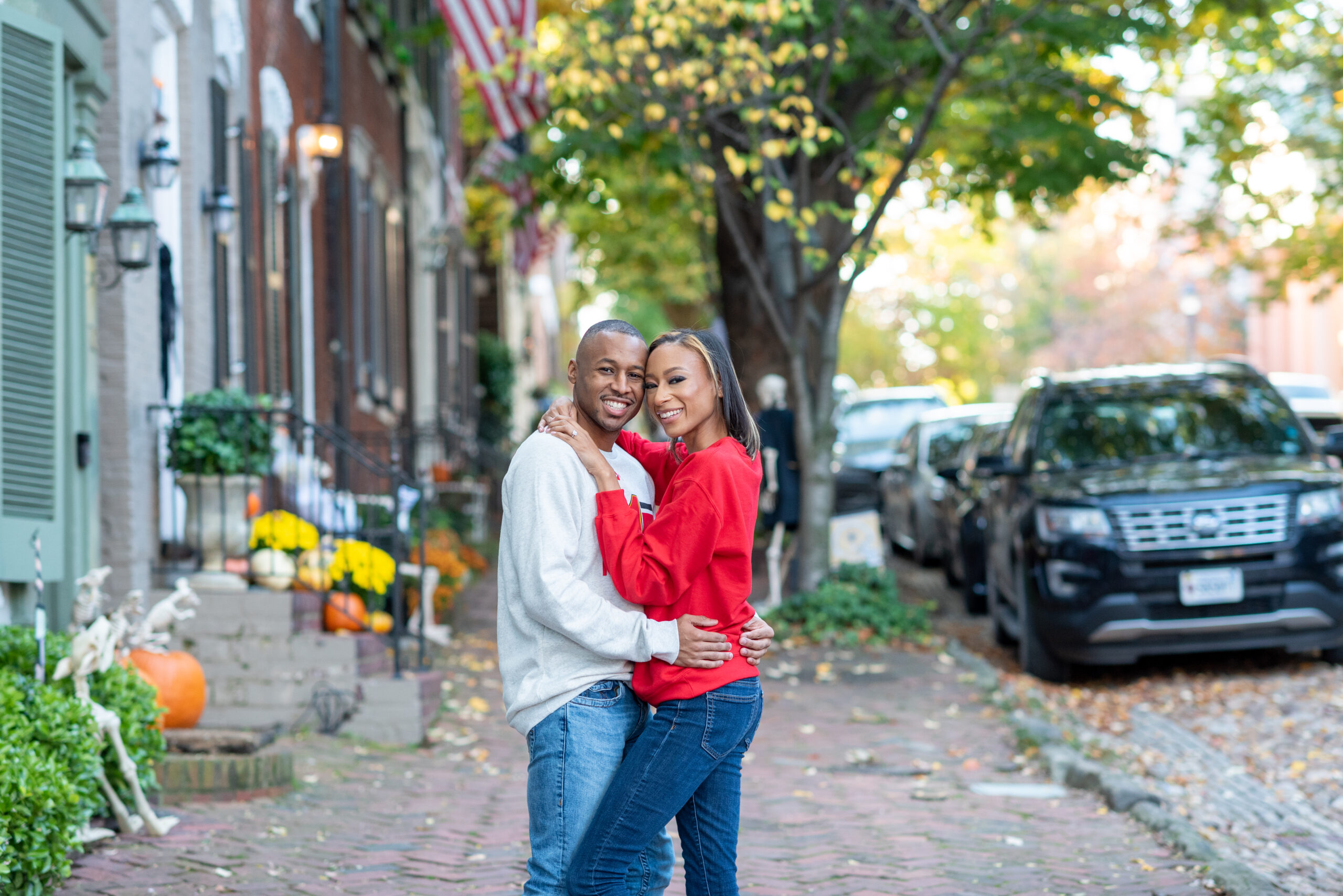 engaged couple posing for photos in Old Town Alexandria