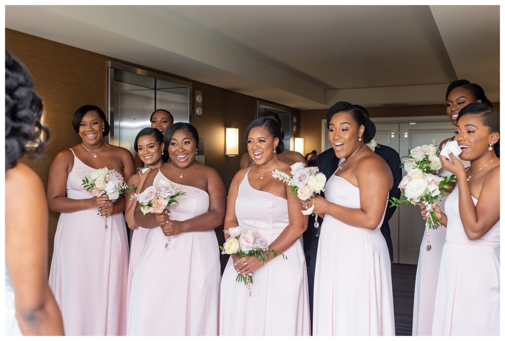bride and bridesmaids first look at hotel for Virginia wedding