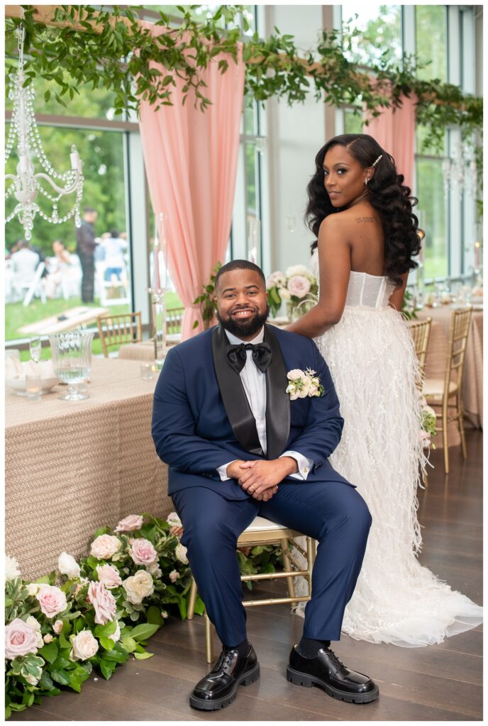 bride and groom posing together inside the reception room at Virginia wedding venue